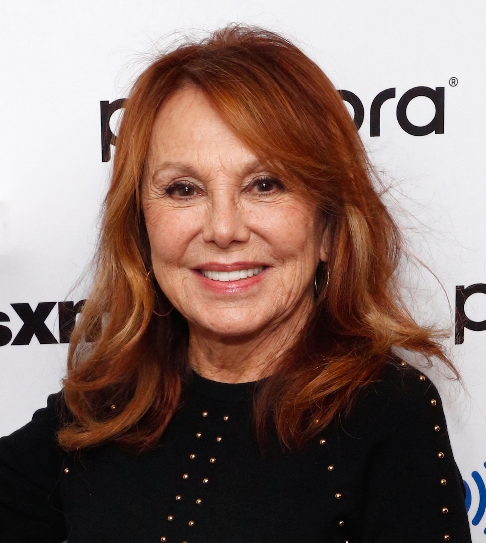 Marlo Thomas laughs during an AI-generated candid portrait captured from the side. | Source: Nano Banana