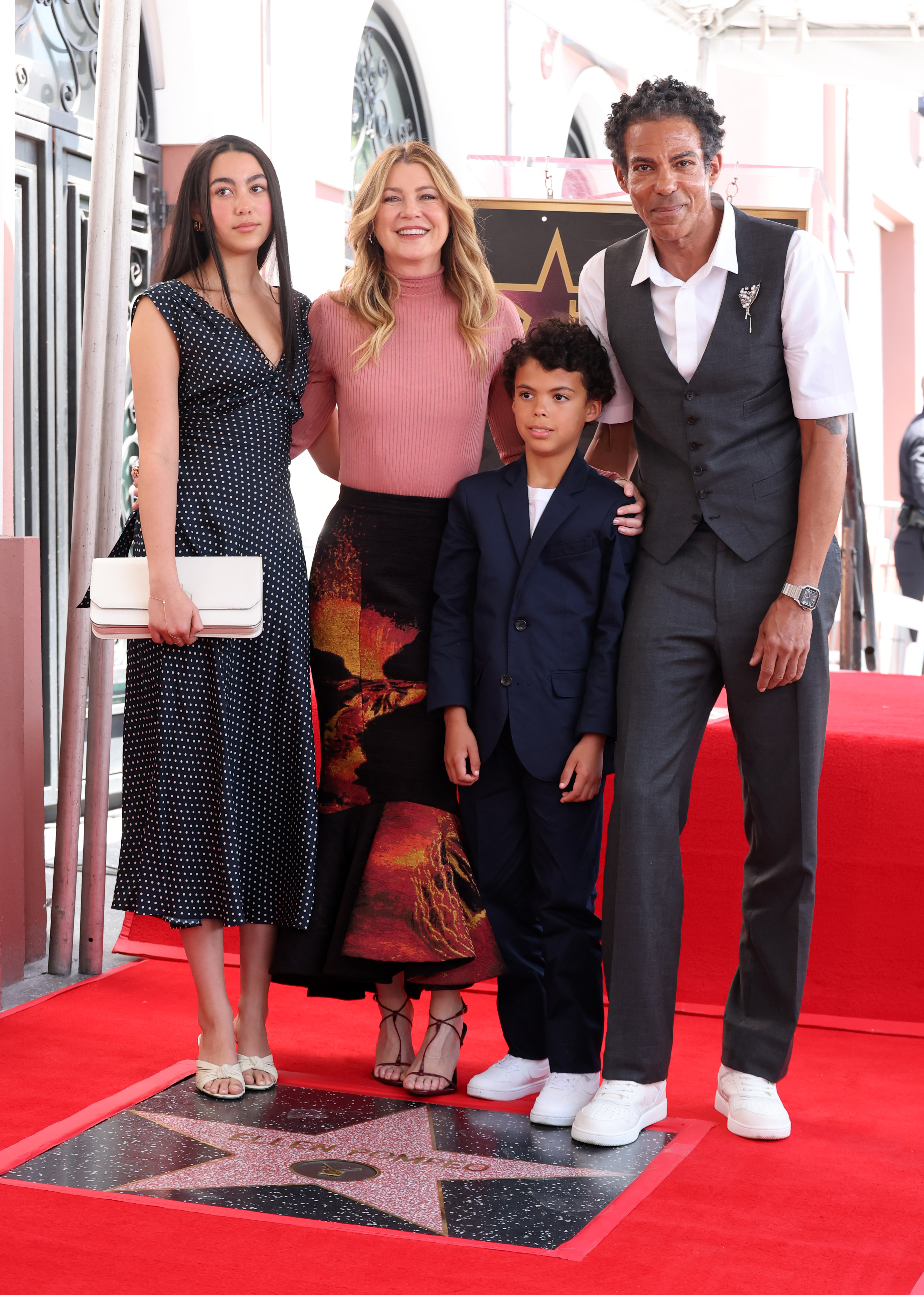 (L-R) Stella, Ellen Pompeo, the couple's son, and Chris Ivery attend the ceremony honoring Ellen Pompeo with a Star on the Hollywood Walk of Fame on April 29, 2025, in Hollywood, California. | Source: Getty Images