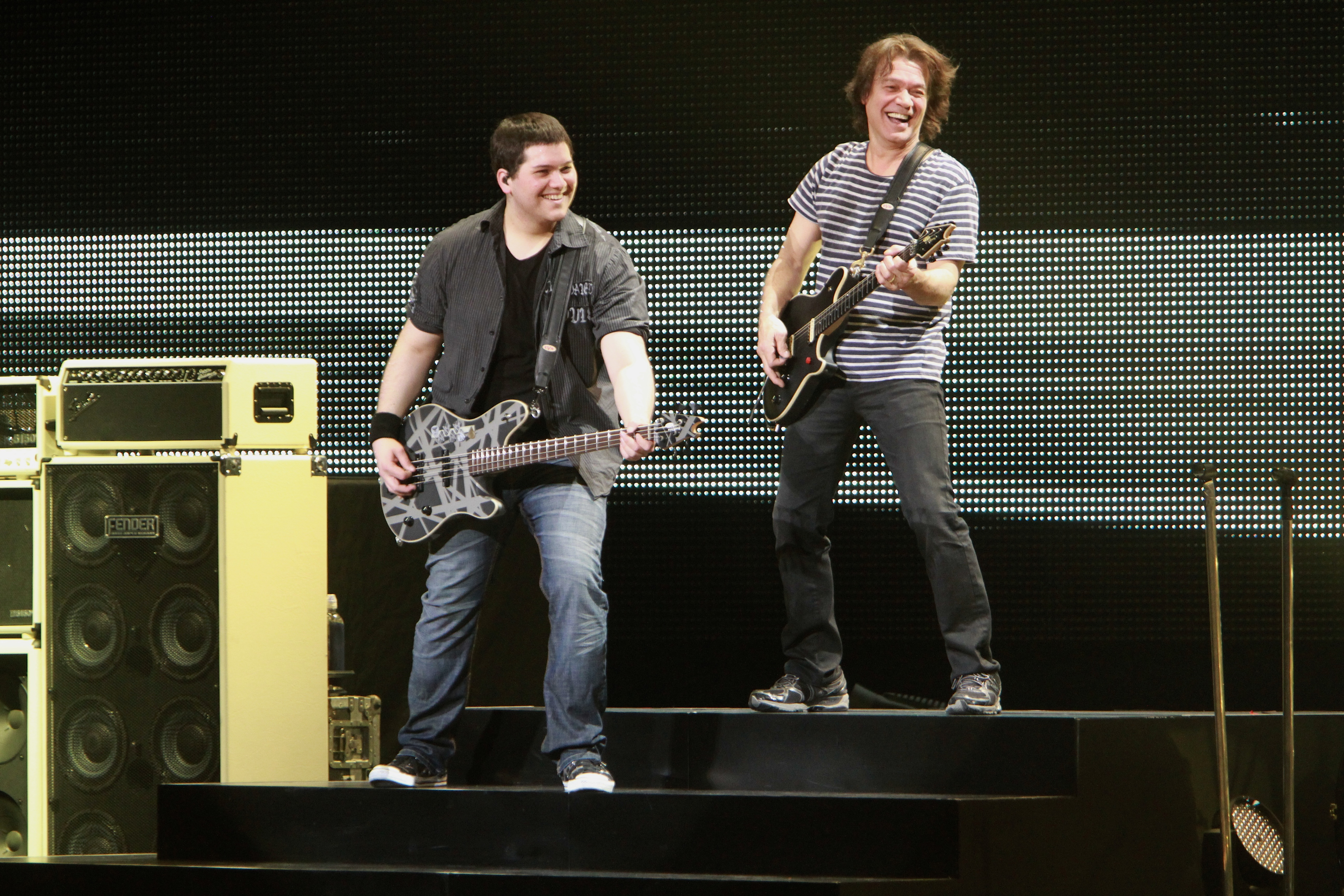 A younger Wolfgang Van Halen performs onstage with his late father, Eddie Van Halen—a resemblance that many fans said was especially evident in Valerie Bertinelli's recent family photo, with several pointing to the pair's shared eyes. | Source: Getty Images