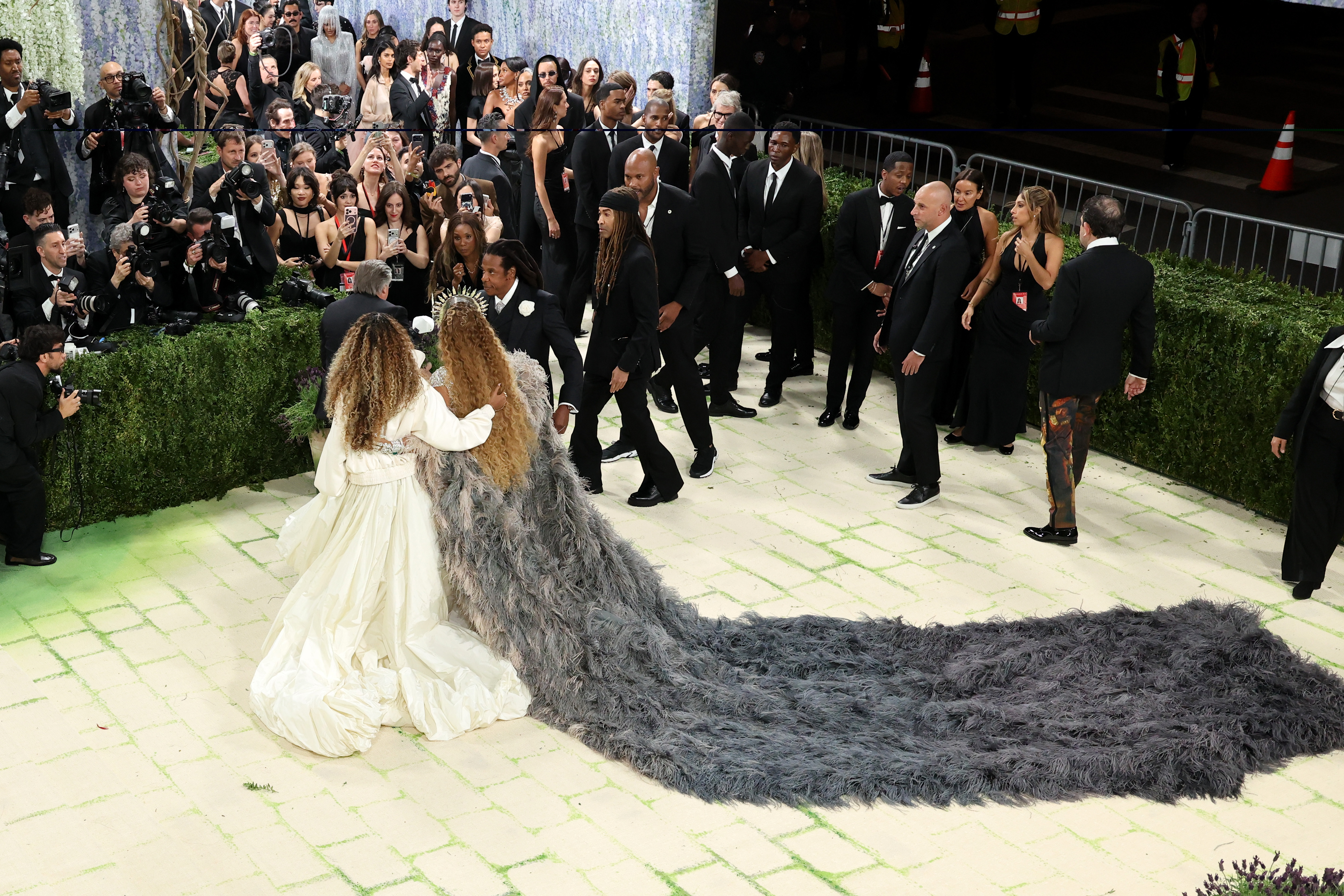 Blue Ivy Carter and Beyoncé pose as Jay-Z walks over to join them on May 4, 2026 | Source: Getty Images