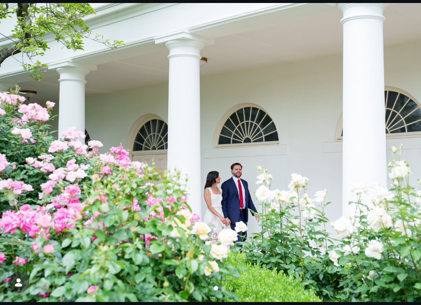 JD Vance and his wife, Usha, are walking side by side outdoors along a colonnaded white building with tall columns and arched windows. |  Source: Instagram/vp