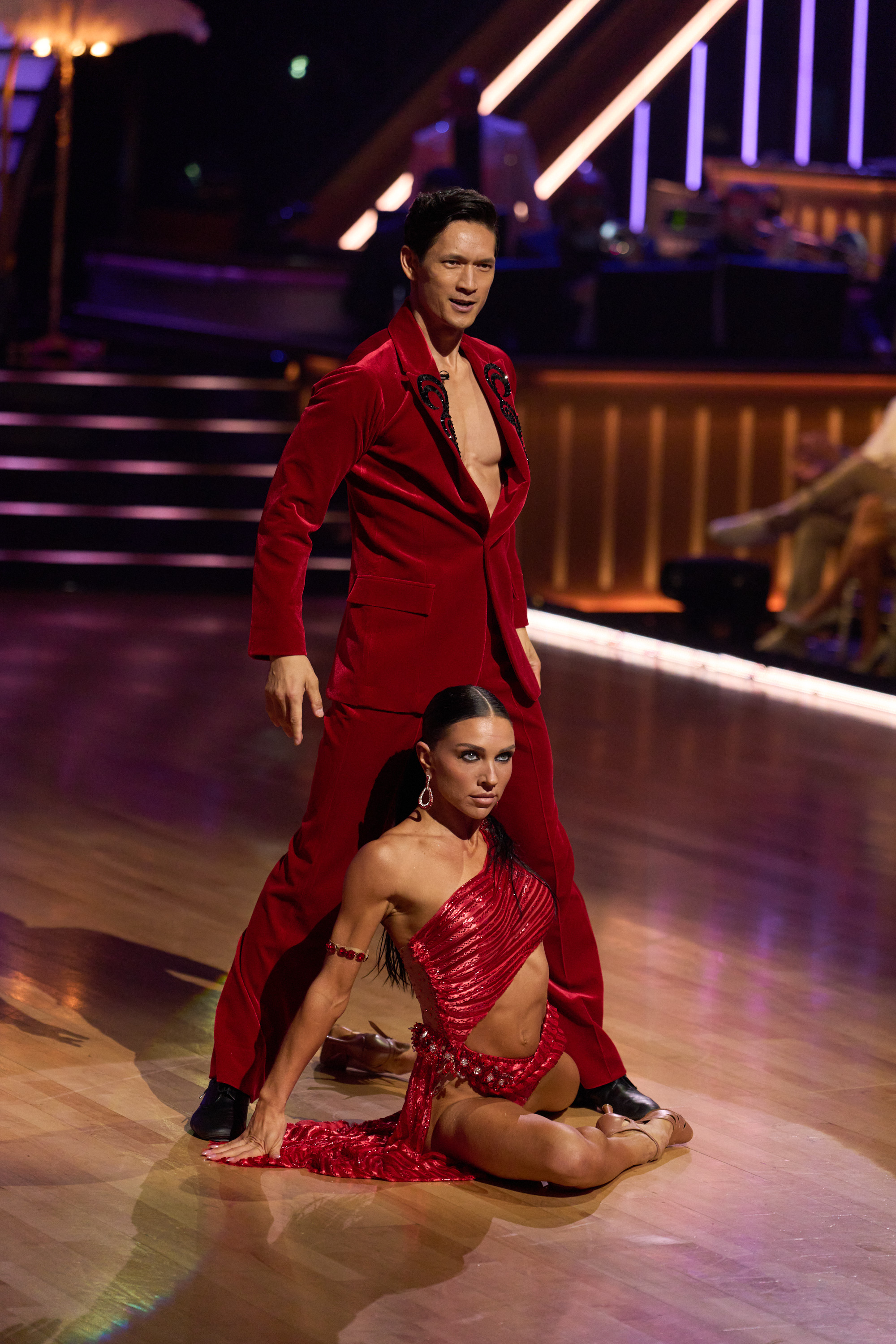 Harry Shum Jr. and Jenna Johnson strike a dramatic finishing pose during "Mariah Carey Night" on "Dancing with the Stars" on October 6, 2026. The pair has been a standout couple throughout season 35, showcasing sharp technical skill each week. Days after this routine, their Super Bowl Night samba sparked a heated lift dispute with judge Carrie Ann Inaba, prompting an online defense from Johnson's husband, Val Chmerkovskiy, that unexpectedly dominated headlines leading into Dedication Night. | Source: Getty Images