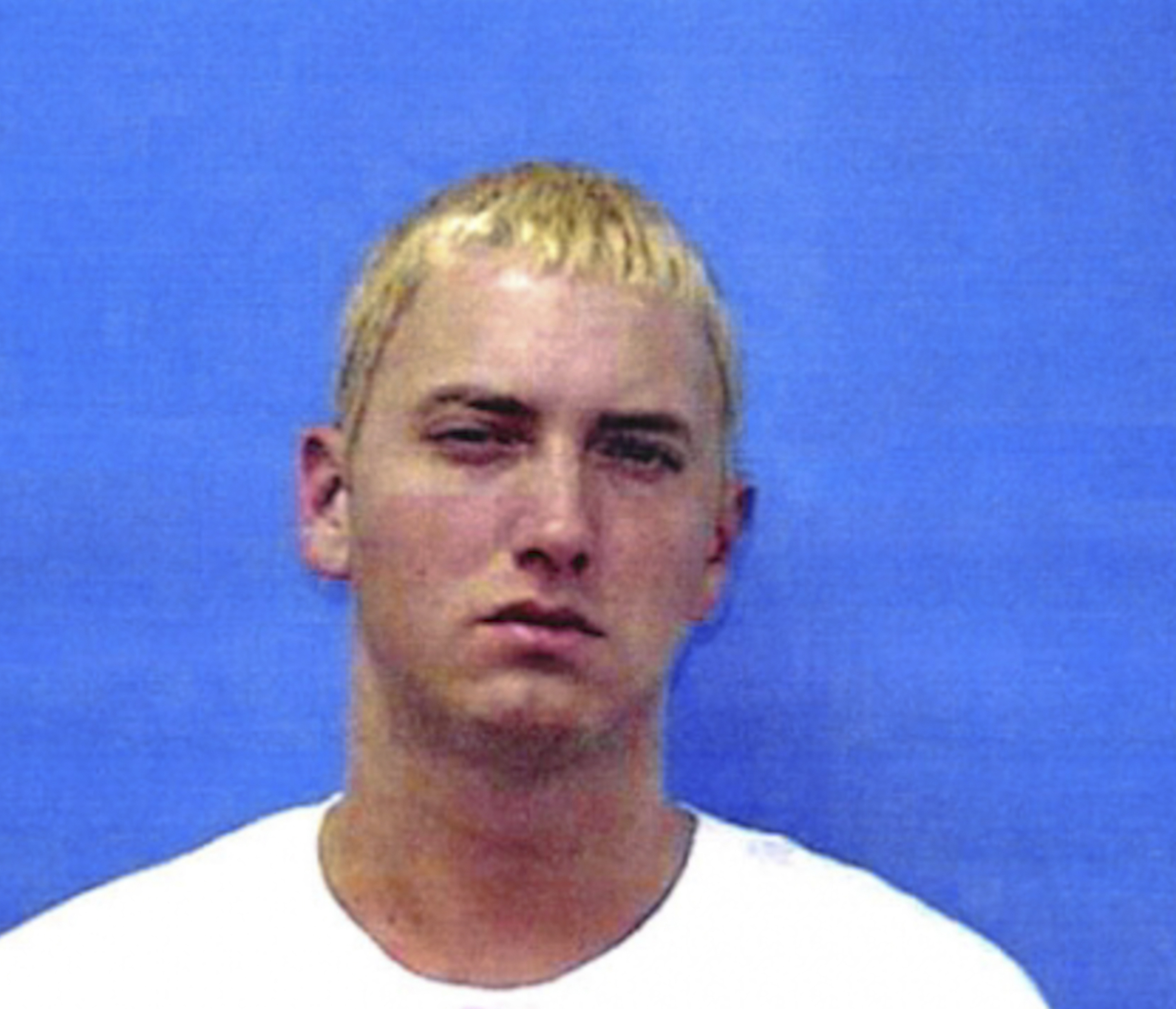 Eminem posing for his mugshot in Warren, Michigan on June 4, 2000. | Source: Getty Images