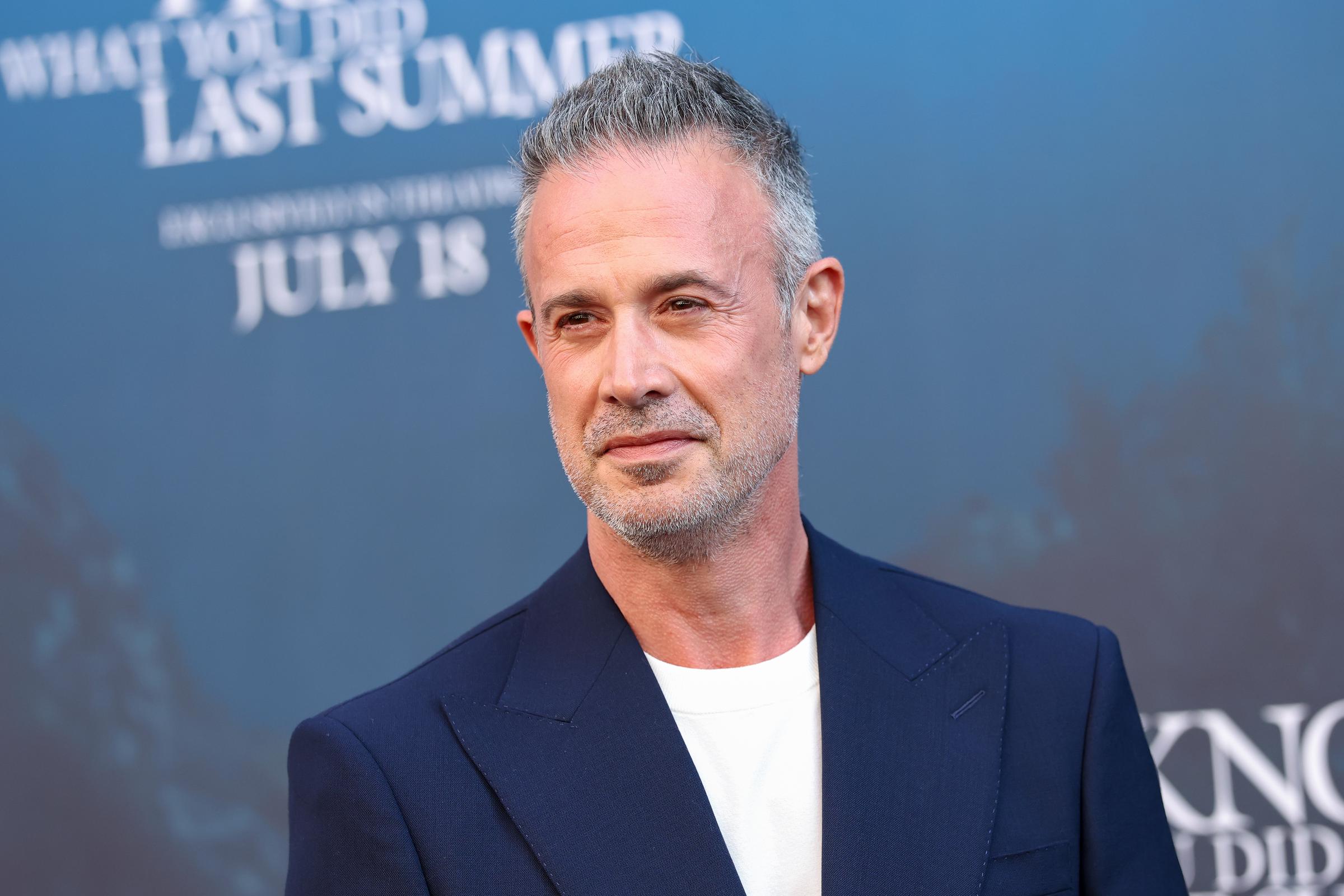 Freddie Prinze Jr. at the same premiere on July 14. He wore a navy blazer over a white crew-neck tee, keeping the look relaxed yet sharp, and showing off close-cropped salt-and-pepper hair with a neatly trimmed beard.
