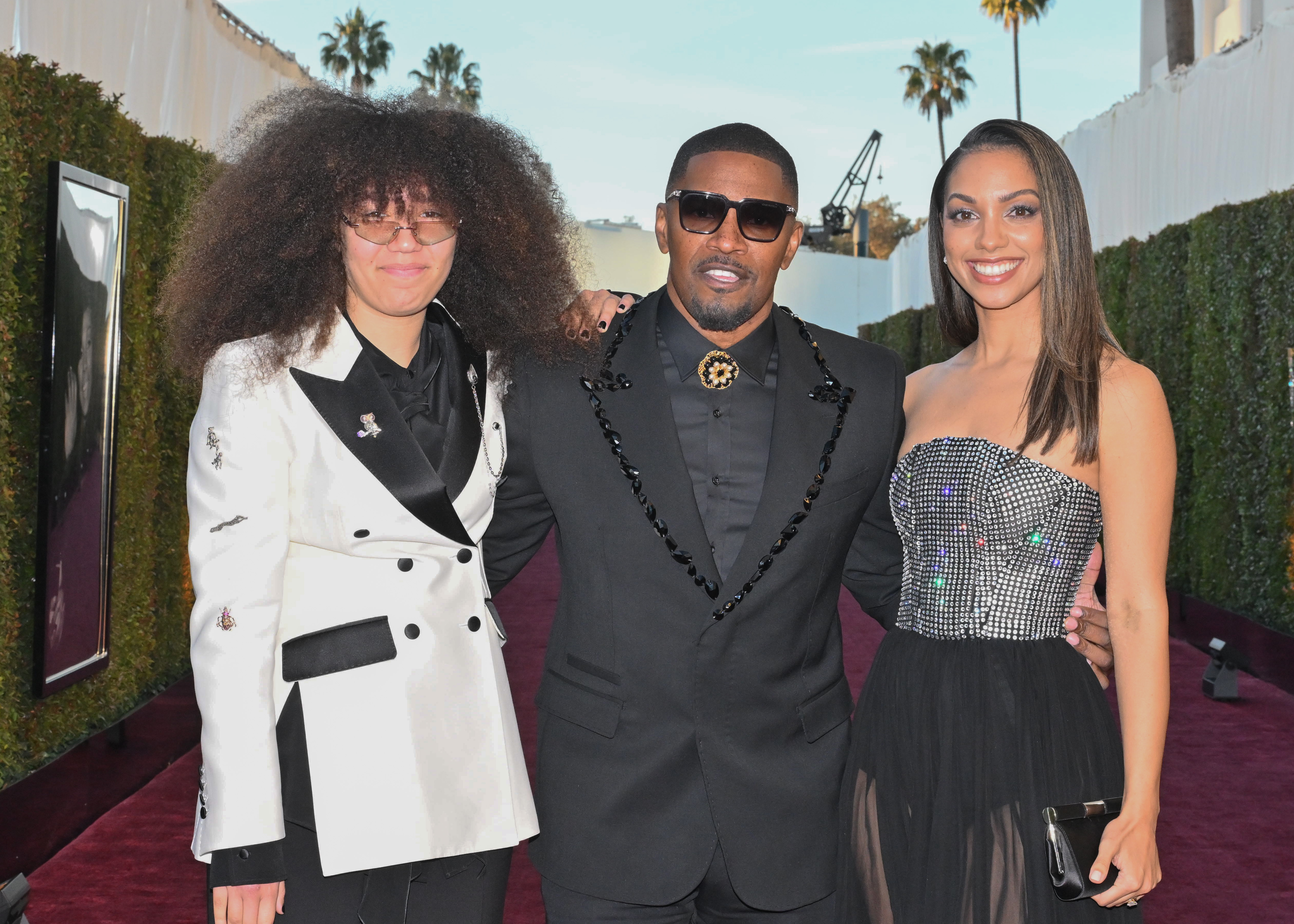 Anelise Bishop, Jamie Foxx, and Corinne Foxx at the 82nd Annual Golden Globes in Beverly Hills, California on January 5, 2025. | Source: Getty Images