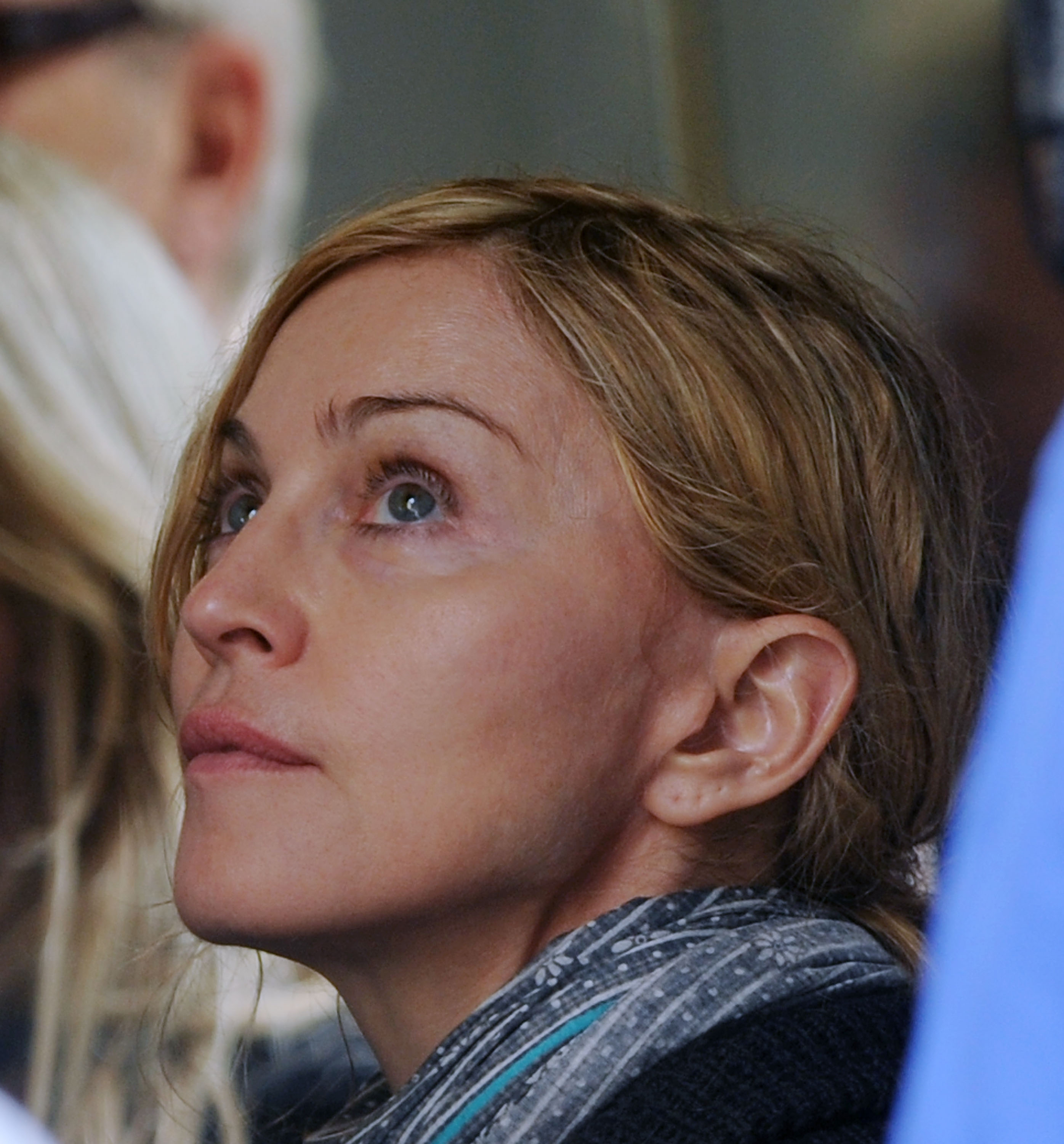 Madonna is photographed in New York City on September 13, 2010, while directing "W.E." on location in Manhattan. The candid close-up shows her looking upward while working behind the camera rather than performing for an audience. | Source: Getty Images