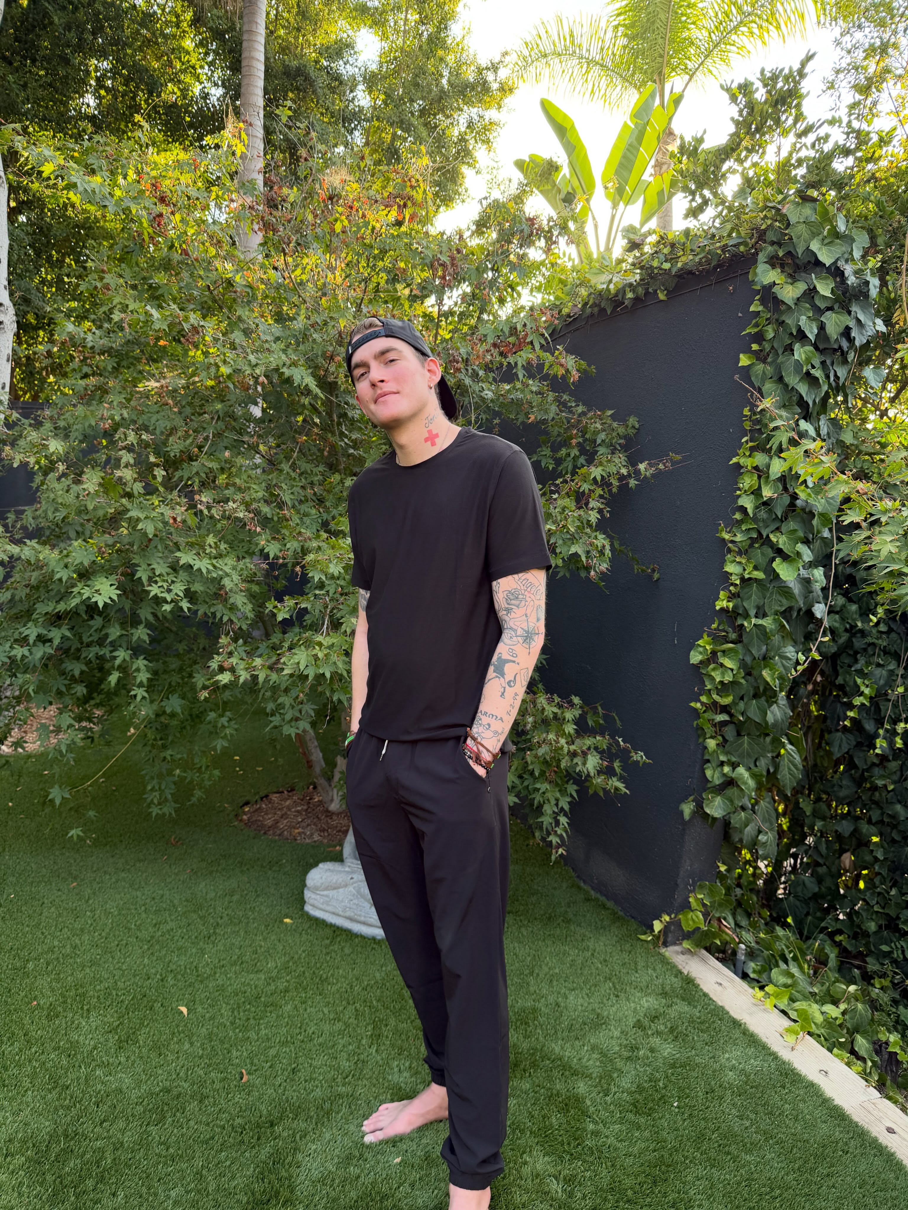 Full-length shot of Presley Gerber in an all-black ensemble, looking directly at the camera with a calm expression in his final Instagram post. | Source: Instagram/presleygerber