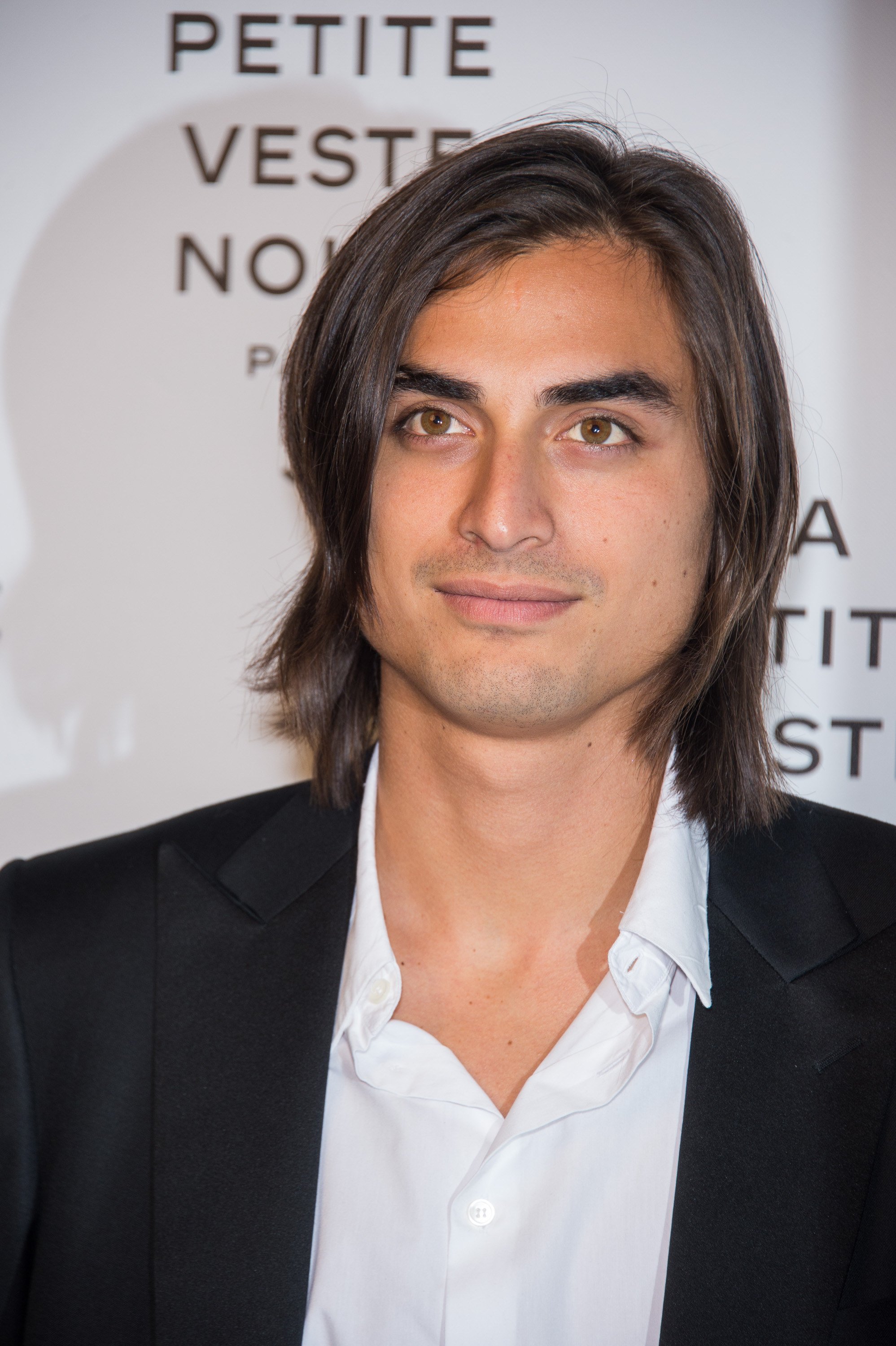 Tuki Brando attends the launch of "La Petite Veste Noire" hosted by Karl Lagerfeld and Carine Roitfeld at the Grand Palais in Paris, France, on November 8, 2012. His growing presence at major industry events reflected the success of a modeling career that began after photographer Bruce Weber spotted his potential.