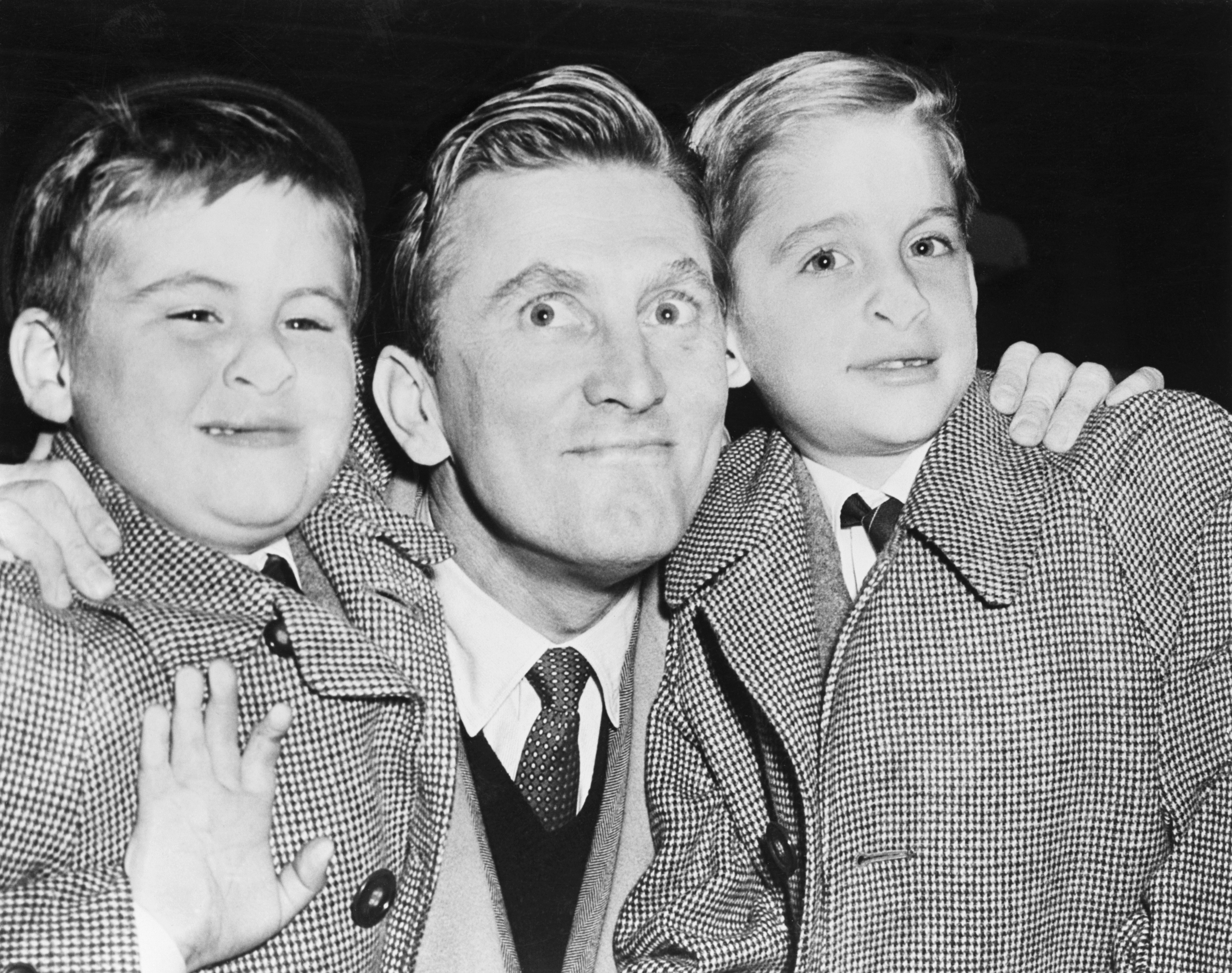 Michael poses with his father, Kirk Douglas, and younger brother, Joel, in 1953. Several years later, Michael and Joel would spend part of their childhood at the Westport, Connecticut, home with their mother, Diana, and stepfather, William Darrid. | Source: Getty Images