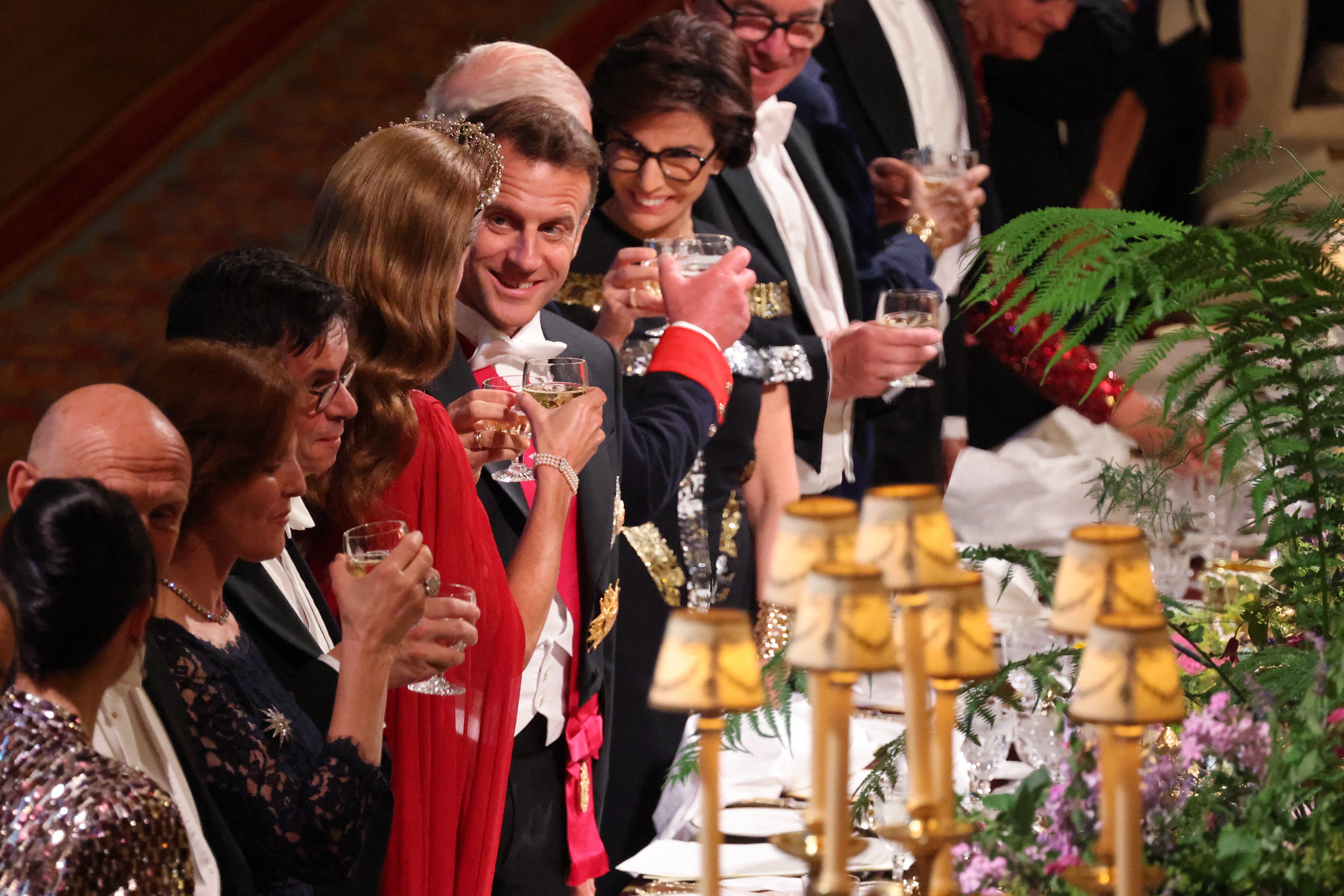President Emmanuel Macron makes conversation with Princess Catherine during the state banquet held during his three-day visit to England. The President is all smiles as he interacts with the Princess.