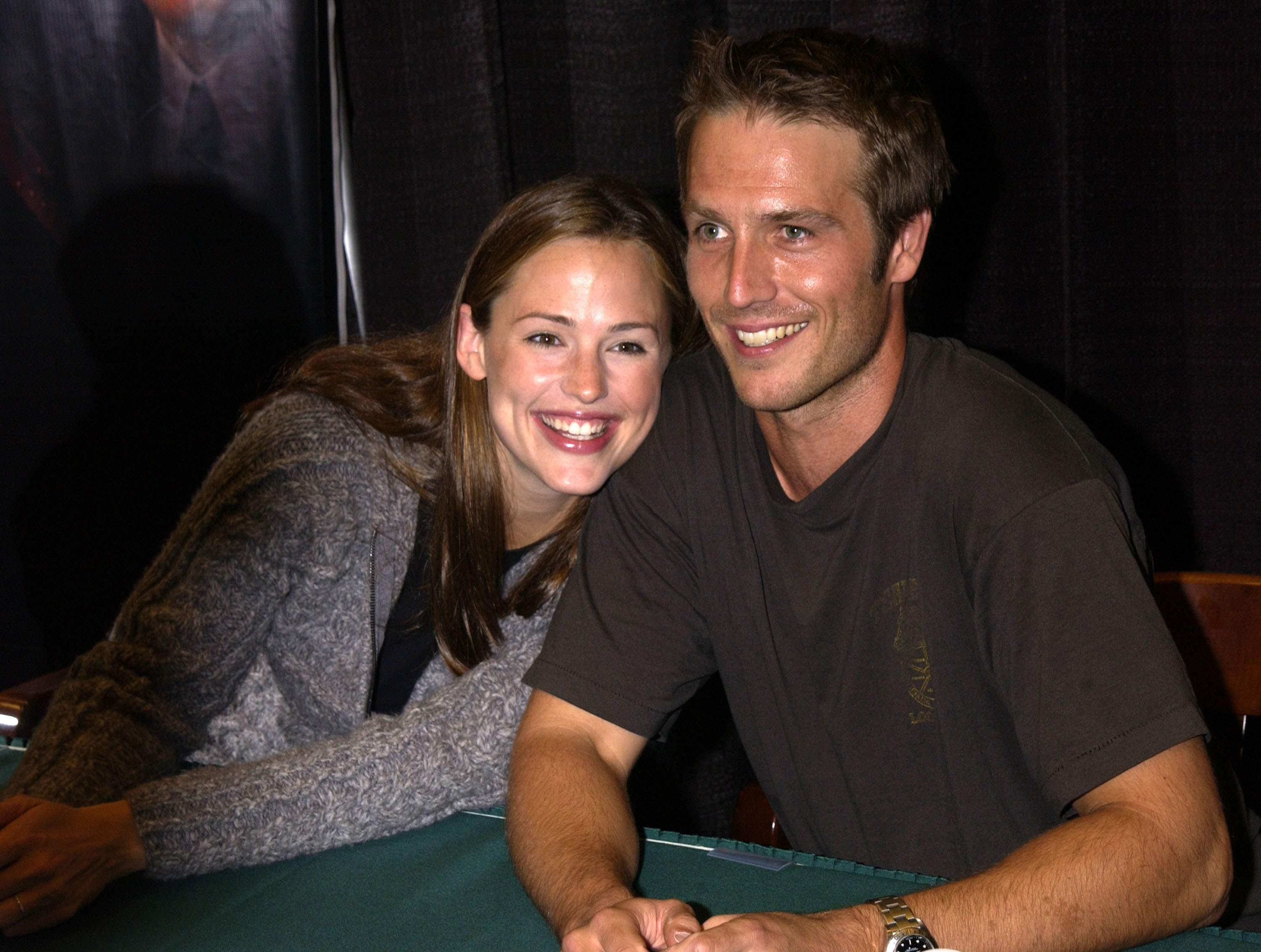 Jennifer Garner and Michael Vartan look cozy at the in-store signing for "Alias: Declassified." Seated next to Vartan at the table, Garner leans her head on his shoulder as the two share bright, warm smiles.
