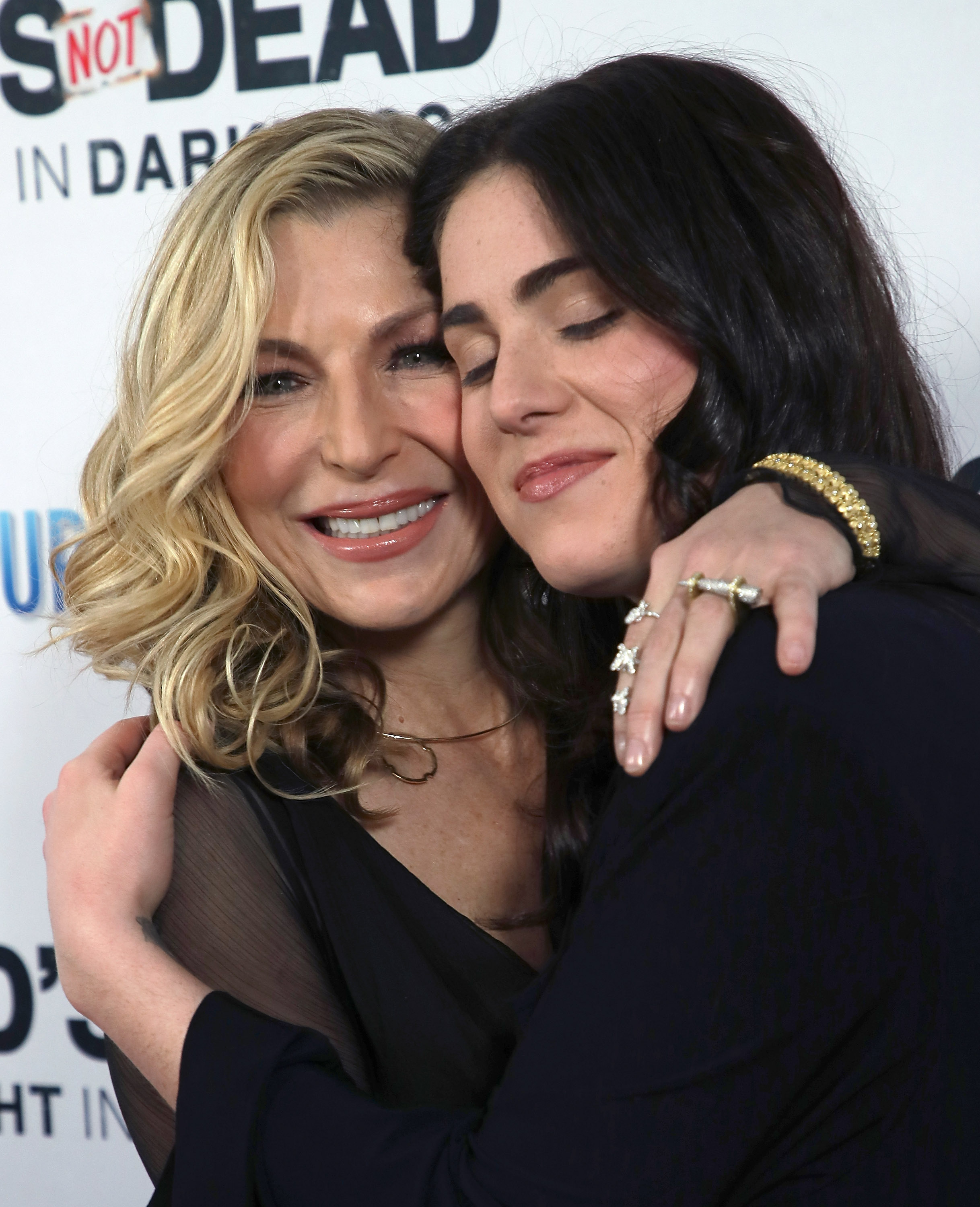 Tatum O'Neal shared a tender embrace with her daughter Emily McEnroe at a Hollywood premiere in March 2018. Five years later, Emily reflected on her mother's survival, saying, "That’s what I want to convey: how far she’s come, how far we’ve come." | Source: Getty Images.