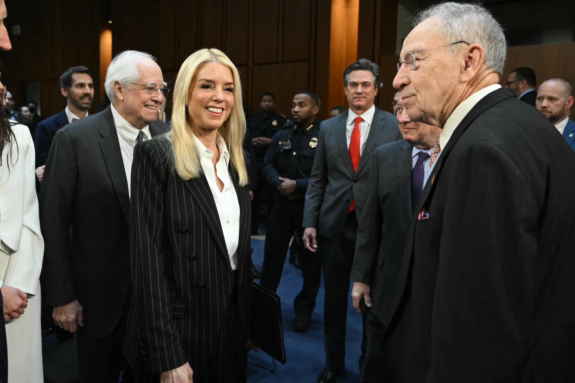 Pam Bondi is greeted by Senator Charles Grassley as she arrives for a Senate Judiciary Committee hearing on Capitol Hill in Washington, D.C., on January 15, 2025 | Source: Getty Images