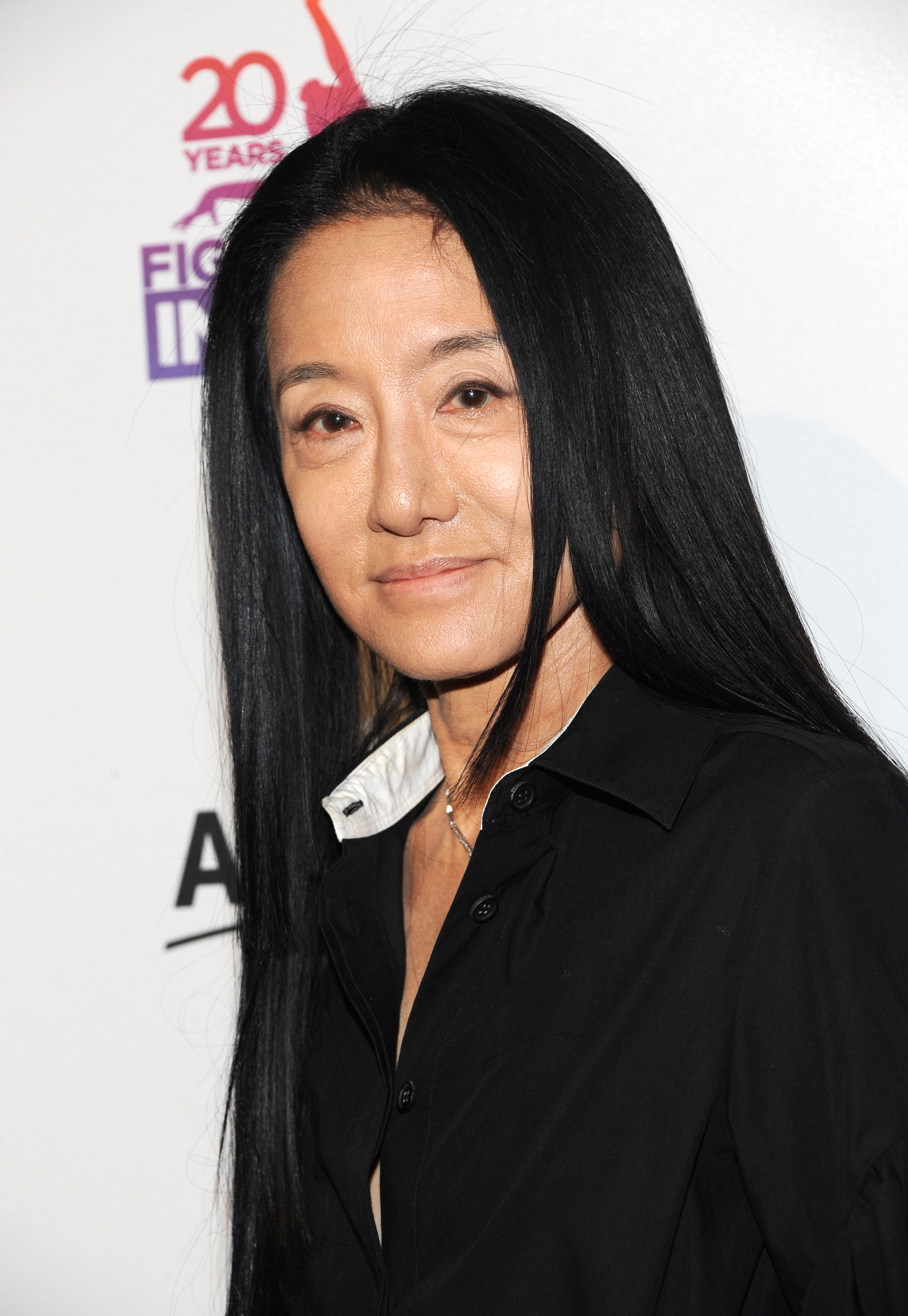 Fashion designer Vera Wang attended the Figure Skating In Harlem 20th Anniversary Champions In Life Benefit Gala at 583 Park Avenue on May 2, 2017, in New York City. Embracing sleek tailoring, she posed in a sharp black button-down shirt featuring an upturned white contrast undercollar, keeping her signature center-parted raven locks cascading straight down her chest. | Source: Getty Images