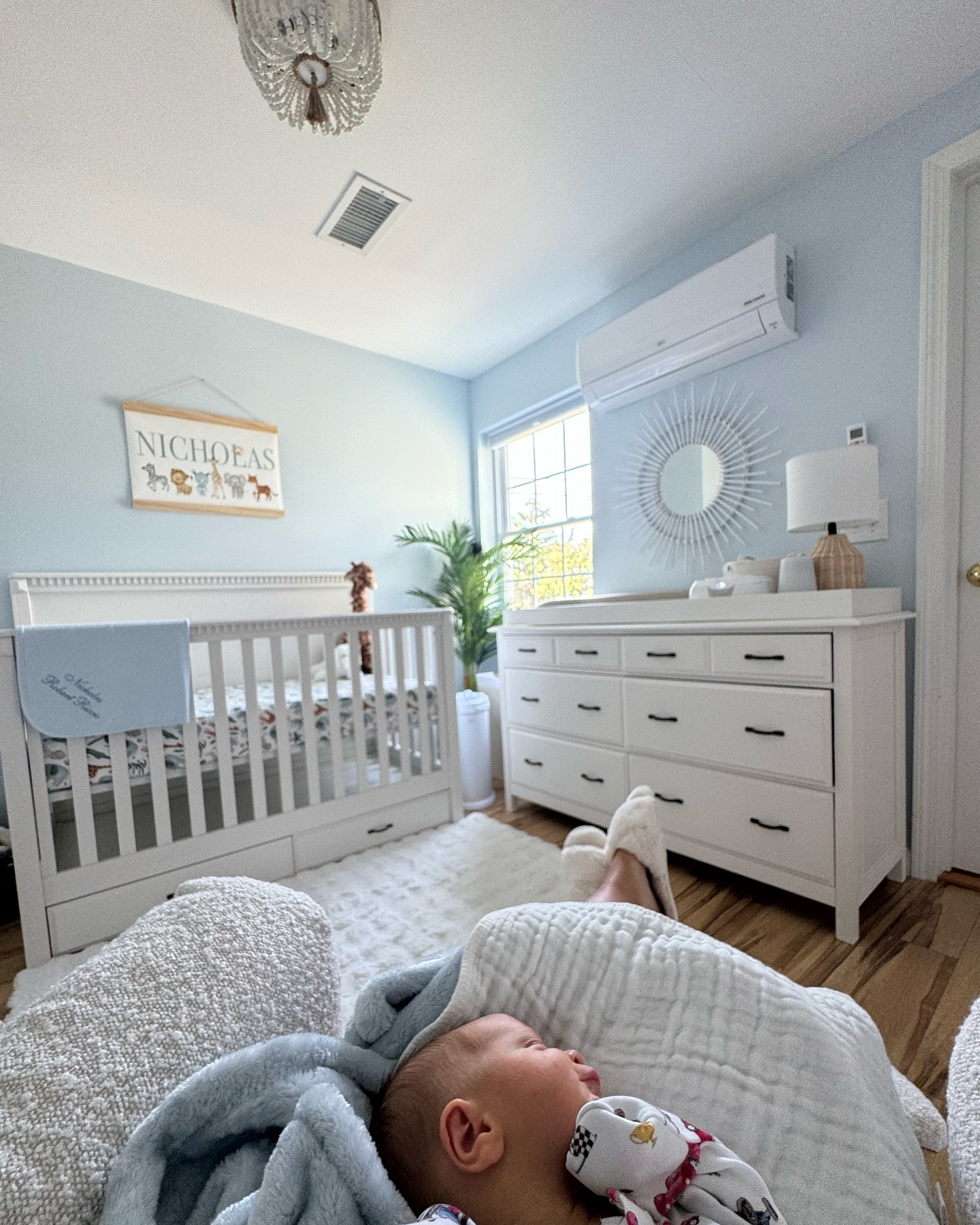 The nursery is perhaps the clearest example of the family home's softer decorating side: light-blue walls, white furniture and warm wood floors create a calm, classic baby-room look. A personalized "NICHOLAS" sign above the crib makes the room unmistakably Niko's. | Source: Instagram/karolineleavitt