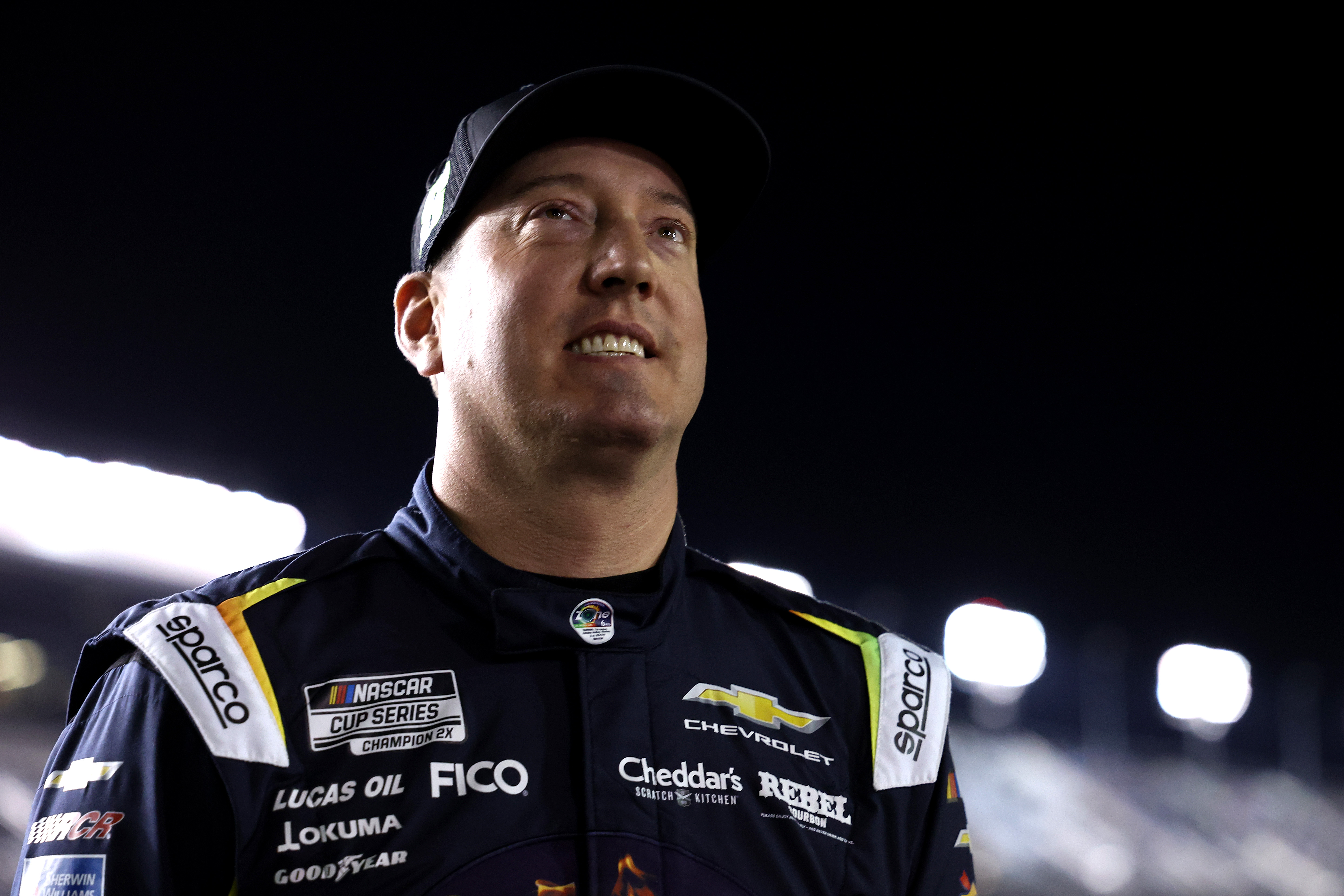 Kyle Busch looks on during qualifying for the Daytona 500 at Daytona International Speedway on Feb. 11, 2026. The two-time NASCAR Cup Series champion, pictured in his racing suit, died months later on May 21 at age 41. | Source: Getty Images