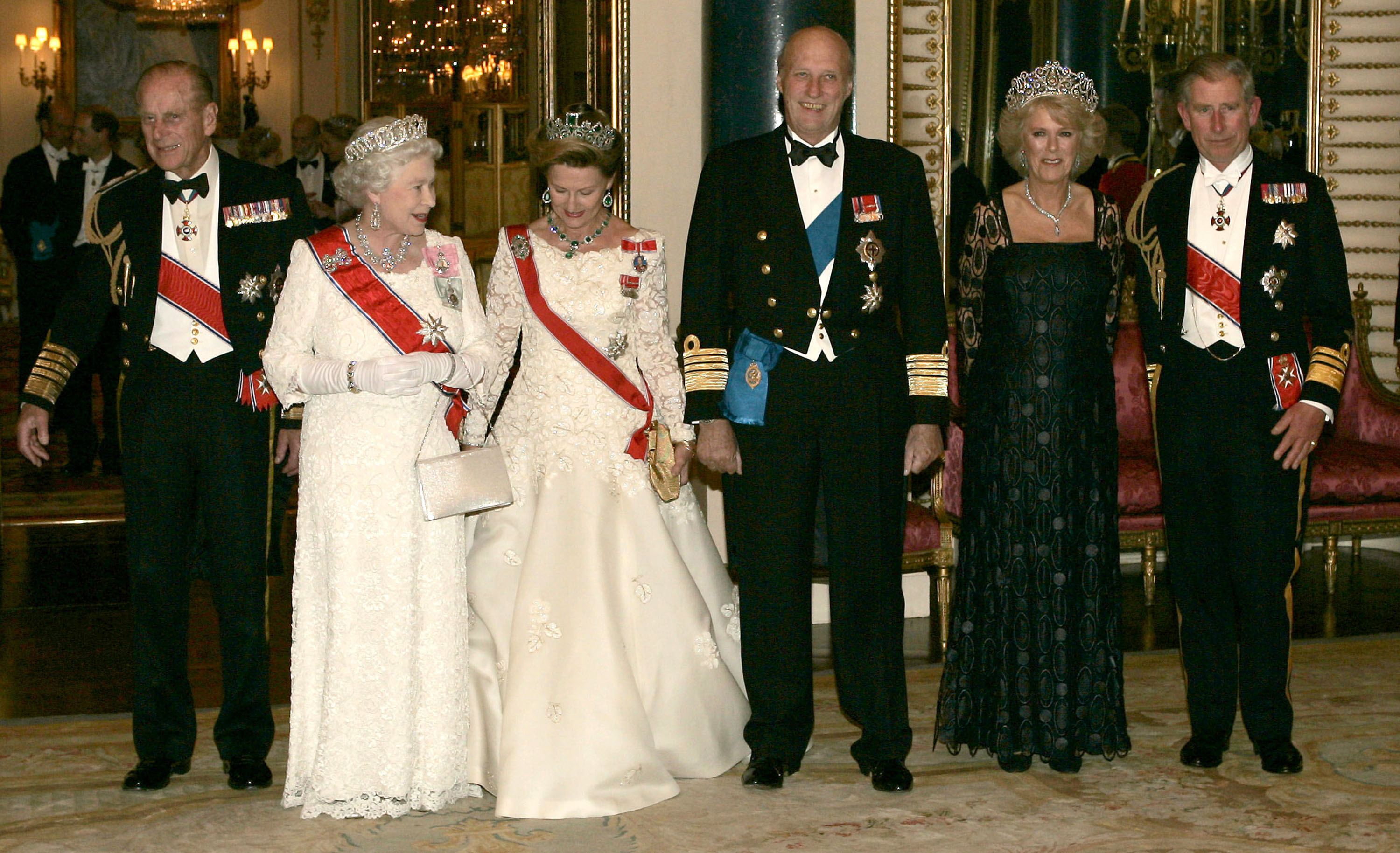 Prince Philip, Duke of Edinburgh, Queen Elizabeth ll, Queen Sonja, King Harald V of Norway, Camilla, Then-Duchess of Cornwall and Charles, Then-Prince of Wales pose before the banquet for the Norwegian Royal Family at Buckingham Palace on October 25, 2005 in London, England. | Source: Getty Images