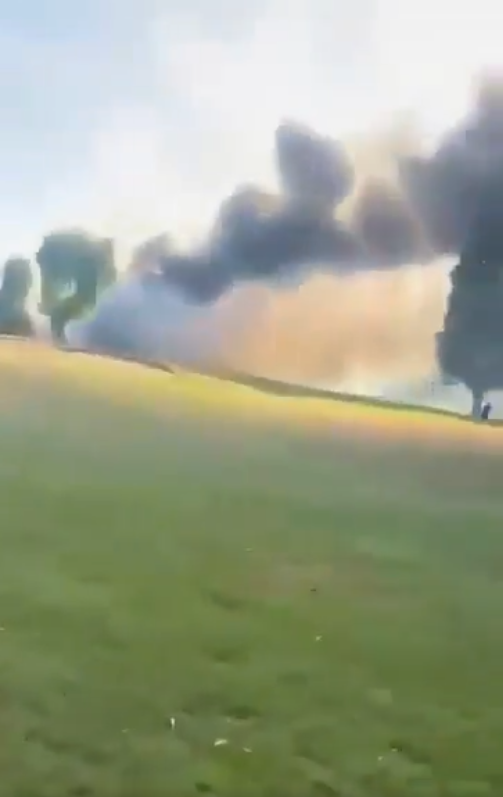 Fireball formed at the crash site, seen from the nearby golf course. From a video dated July 13, 2025. | Source: X/SVS News Agency