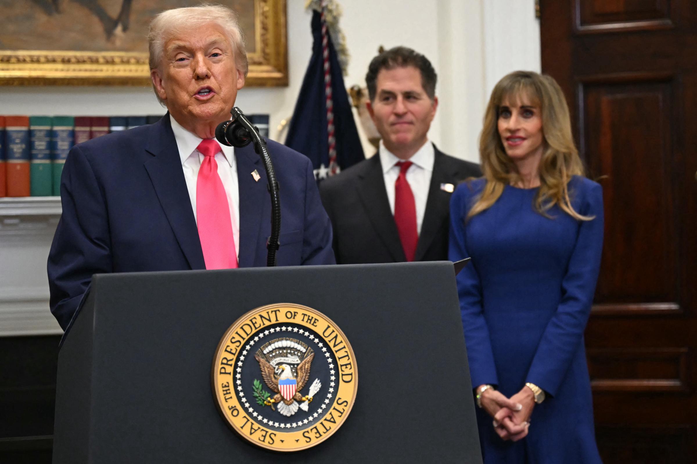 Susan Dell stands alongside her husband Michael Dell as President Donald Trump announces their $6.25 billion donation to fund investment accounts for American children in the Roosevelt Room of the White House in Washington, D.C. The couple stood behind Trump as he spoke at the podium.