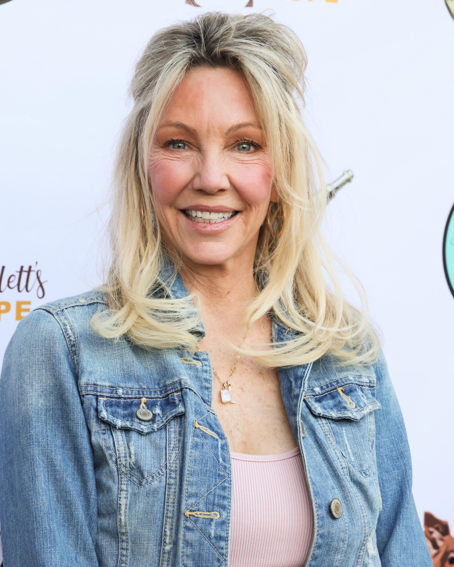 Locklear's recognizable smile has remained part of her public image from her early television days into her sixties. Her career and personal milestones have kept audiences interested in her life well beyond "Melrose Place." | Source: Getty Images