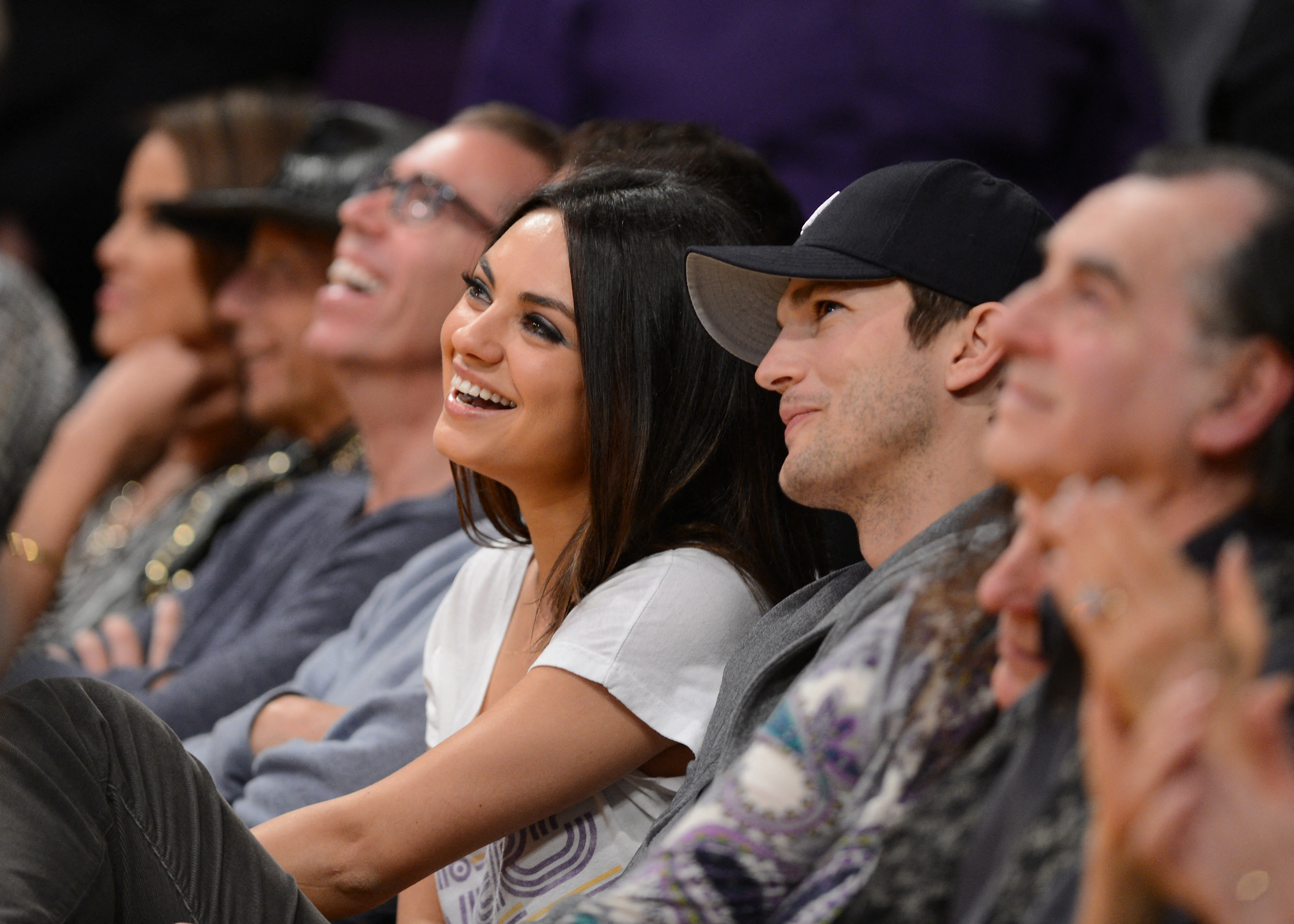 Mila Kunis and Ashton Kutcher courtside at the Los Angeles Lakers NBA matchup against the Phoenix Suns at Staples Center in Los Angeles, California, on February 12, 2013. | Source: Getty Images