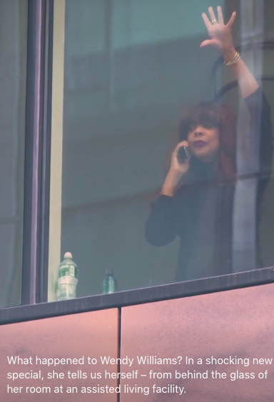 Wendy Williams standing by a glass window with her hand placed on it | Source: Facebook/TMZ