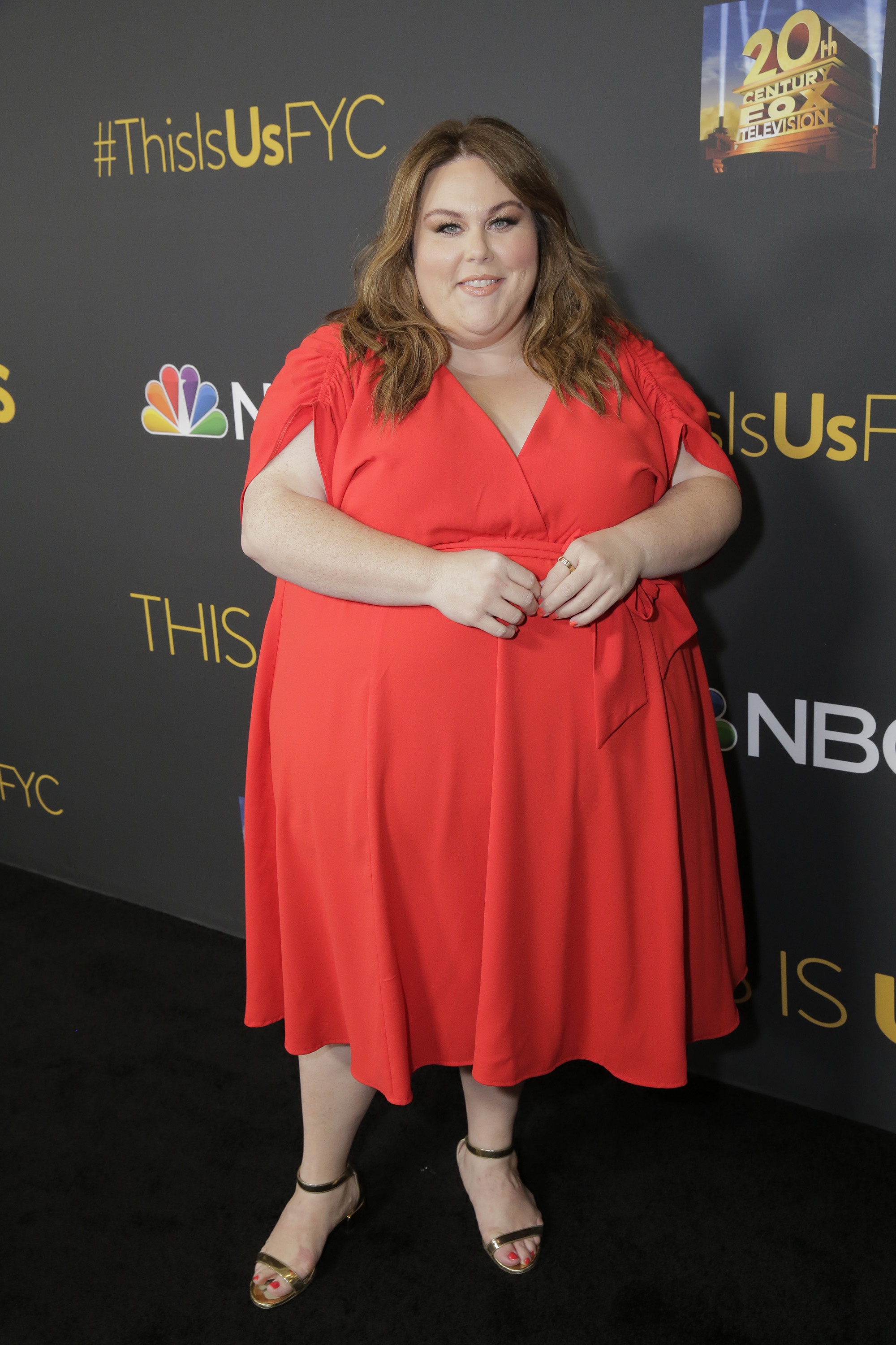 She wore a bright red wrap-style dress to a "This Is Us" FYC event. By then, Metz was making regular appearances tied to the series that had made her widely known.