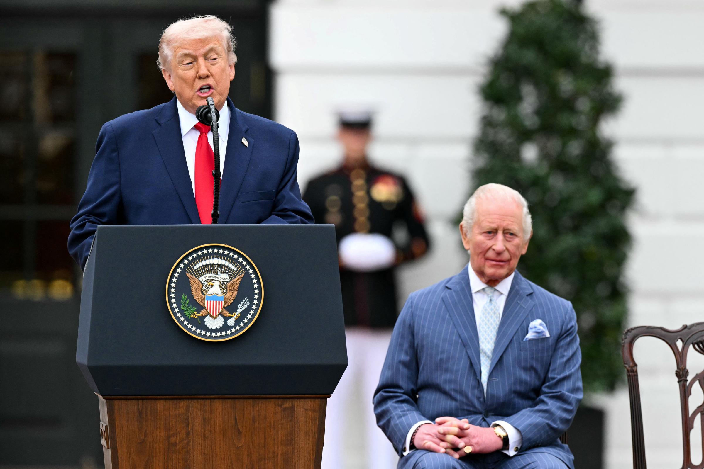 Donald Trump speaks as Britain's King Charles III looks on during an arrival ceremony on the South Lawn of the White House | Source: Getty Images