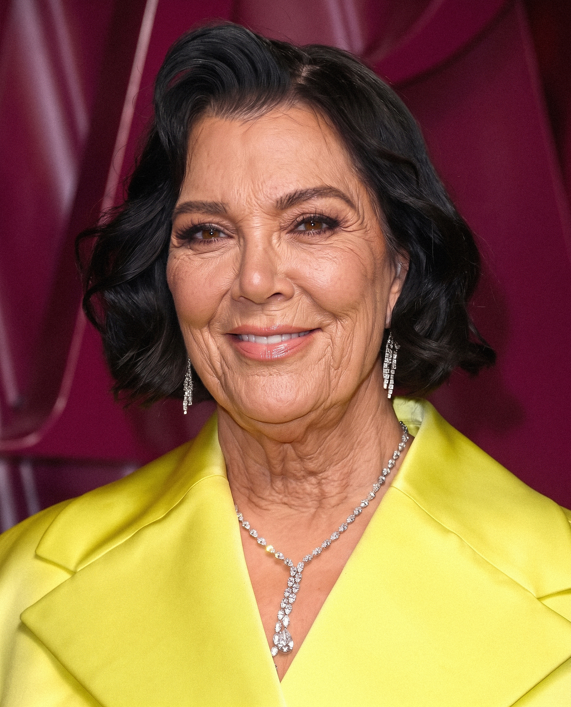 Dressed in a bright yellow blazer, Kris wears a softly styled bob as natural creases around her eyes, cheeks and neck become part of the imagined portrait. | Source: Gemini