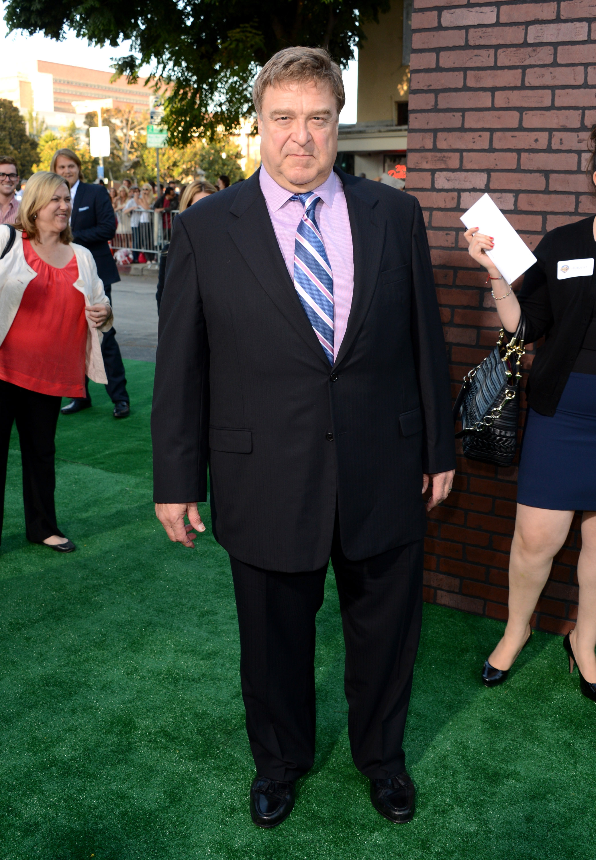 With a playful frown and tight lips, Goodman took pictures on the green carpet of the Warner Bros. Pictures' "Trouble With The Curve" premiere at Regency Village Theatre, in Westwood, California.