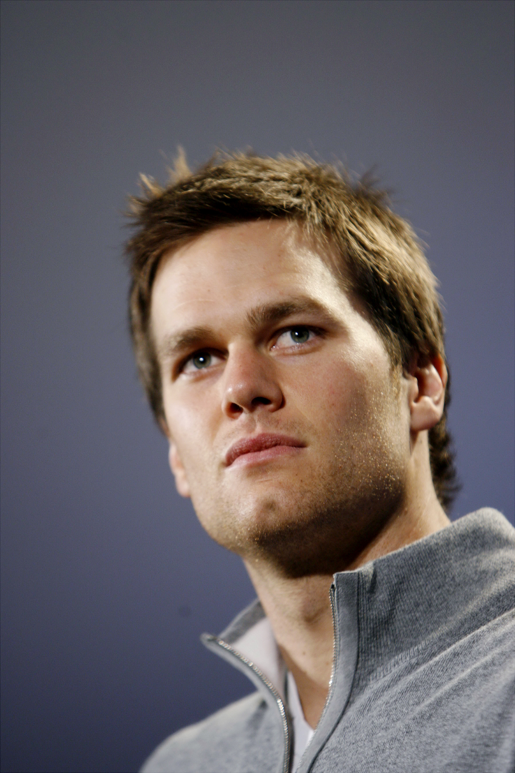 Brady spoke to reporters in Scottsdale ahead of Super Bowl XLII, sporting a clean-cut look during the Patriots' undefeated 2007 season.