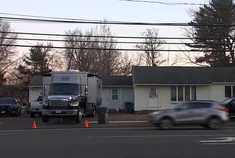 Police vehicles outside of Eve Rogers' house, in a news report dated March 19, 2026 | Source: YouTube/WFSB 3