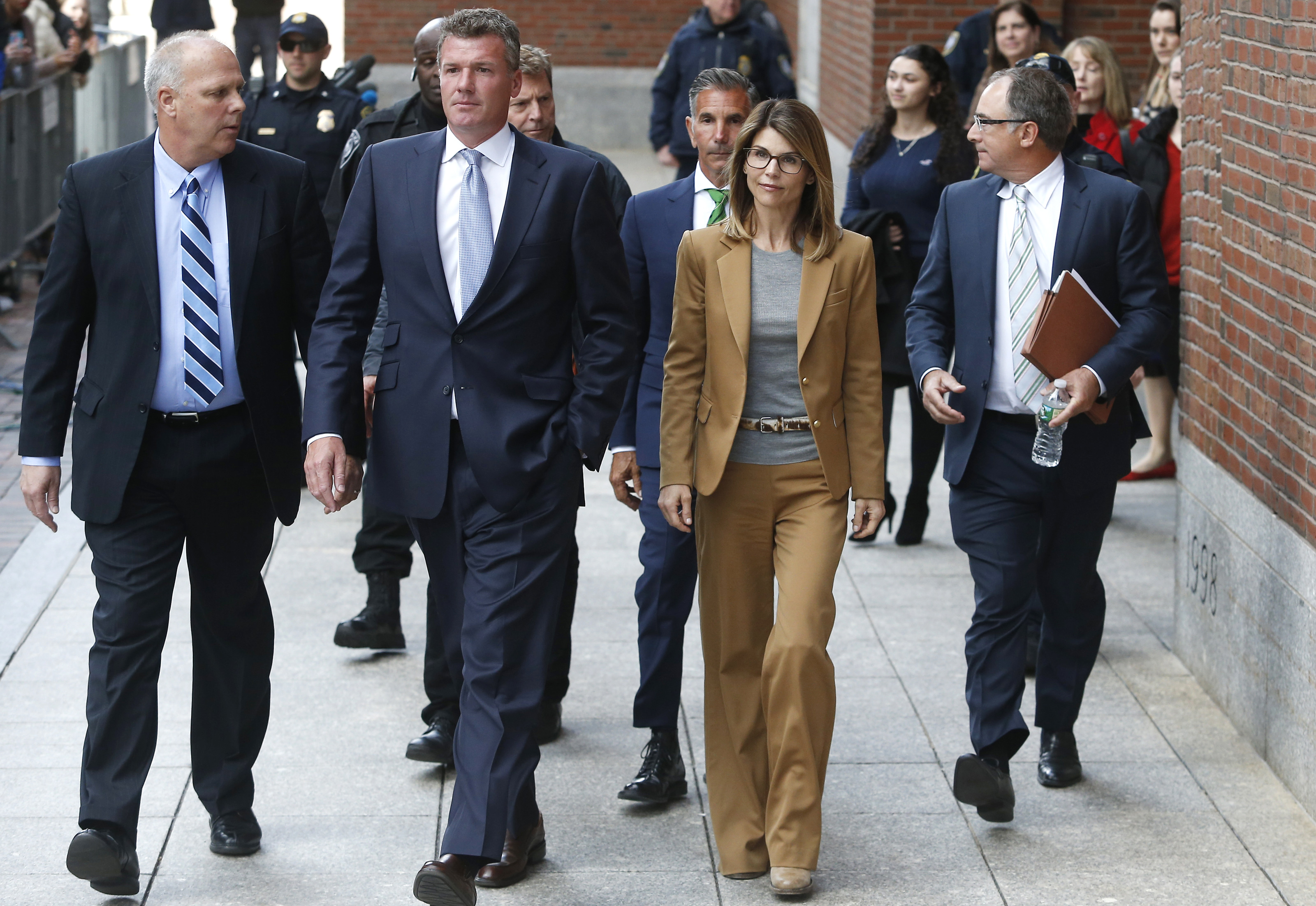 Lori Loughlin and Mossimo Giannulli faced mounting legal pressure as they arrived for their first court appearance in connection with the nationwide college admissions bribery scandal. In this photo, they departed John Joseph Moakley United States Courthouse on April 3, 2019, in Boston, Massachusetts. | Source: Getty Images