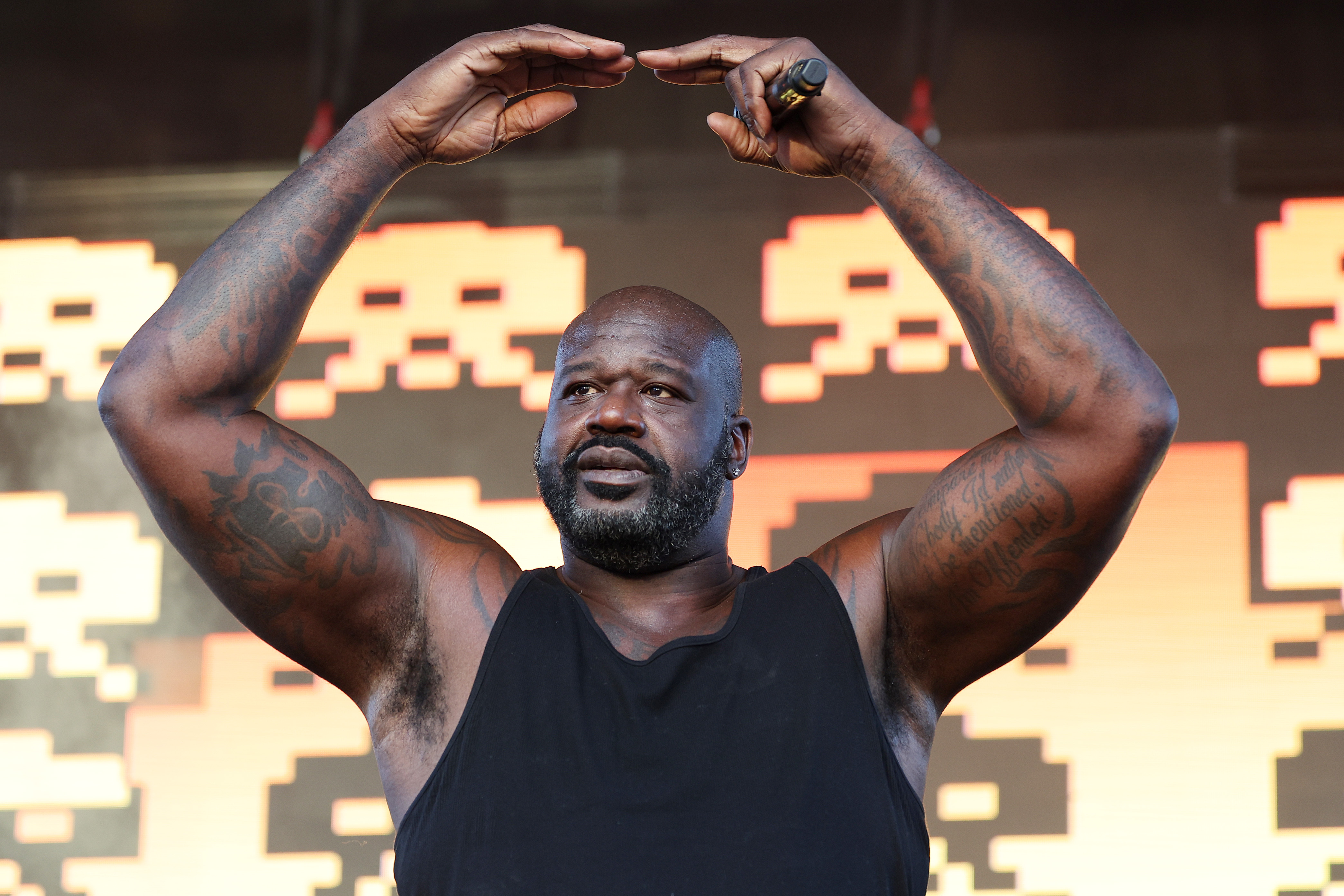 Shaquille O'Neal DJs ahead of the College Football Playoff Quarterfinal at the Cotton Bowl Classic in Arlington, Texas on December 31, 2025. | Source: Getty Images