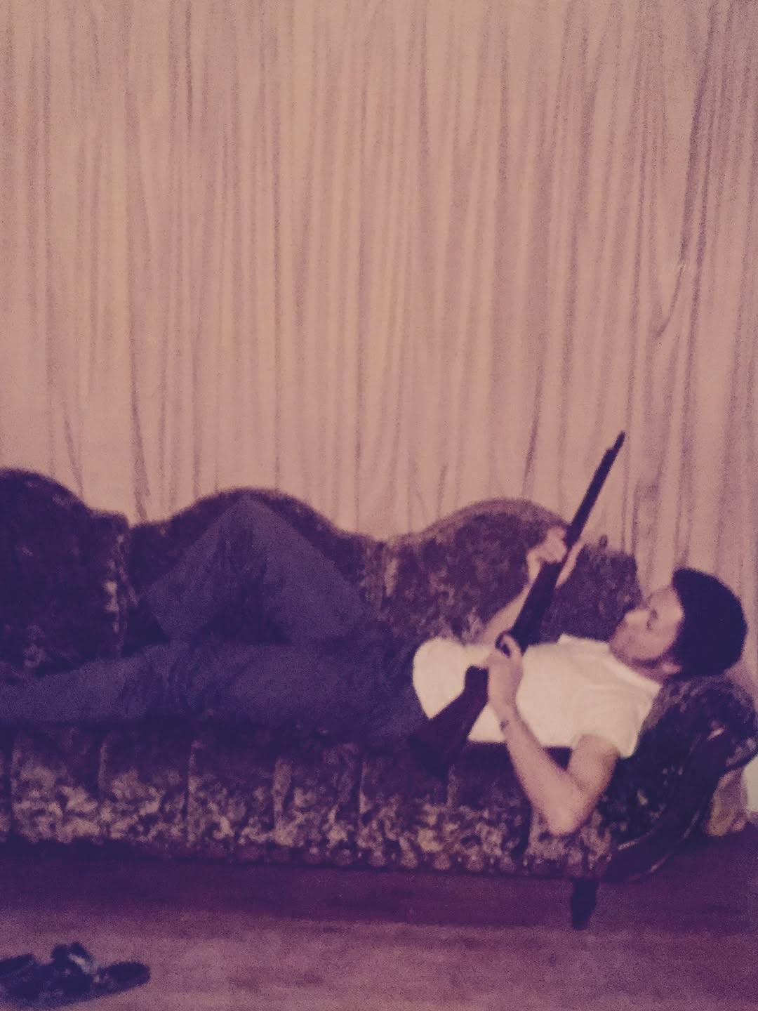 A nostalgic image of Monica's dad, M.C. Arnold Jr., holding a gun. | Source: Instagram/monicadenise