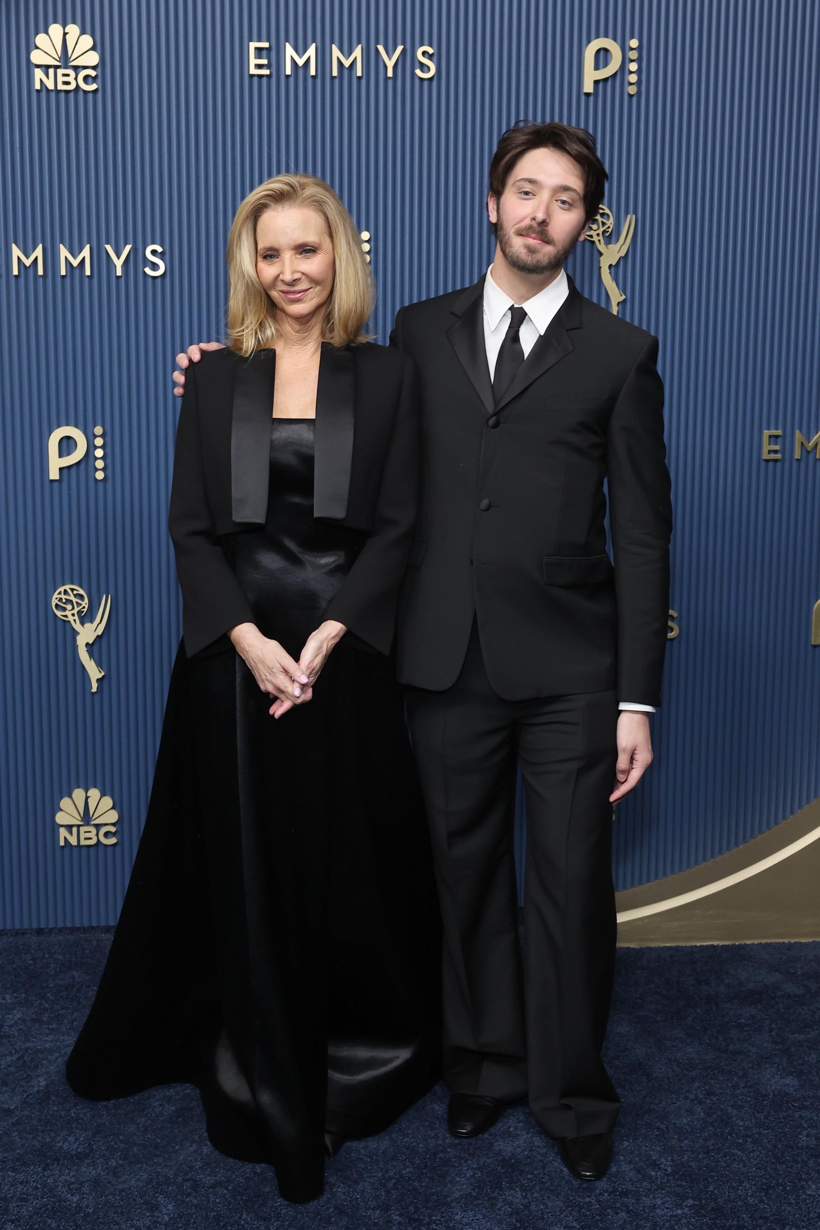 Stern complemented his mother's look in a black suit, white shirt, and black tie. Some of their side-by-side poses had a more formal quality, a detail that also caught the attention of a Facebook commenter. | Source: Getty Images