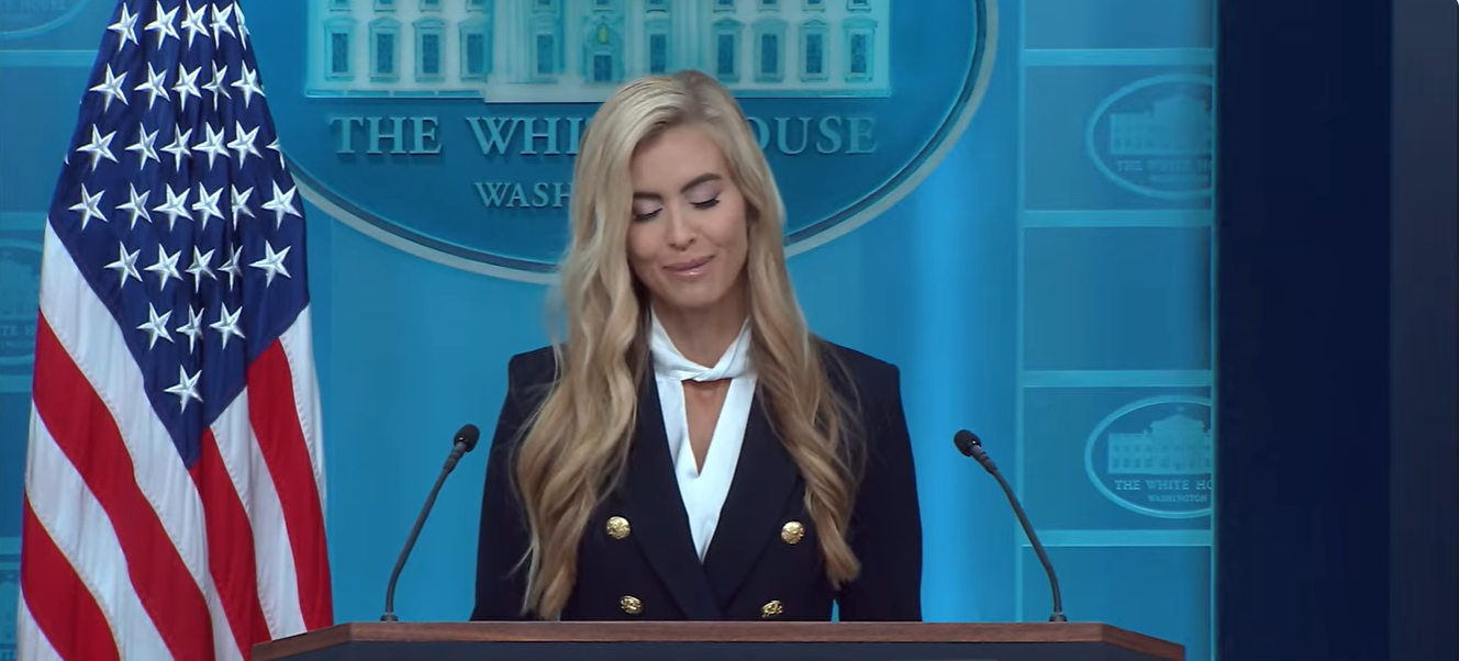 Katie Zacharia smiles during her first White House press briefing, where she briefly stumbled over her words while discussing her husband, correcting herself after accidentally referring to him as the president. | Source: YouTube/The White House