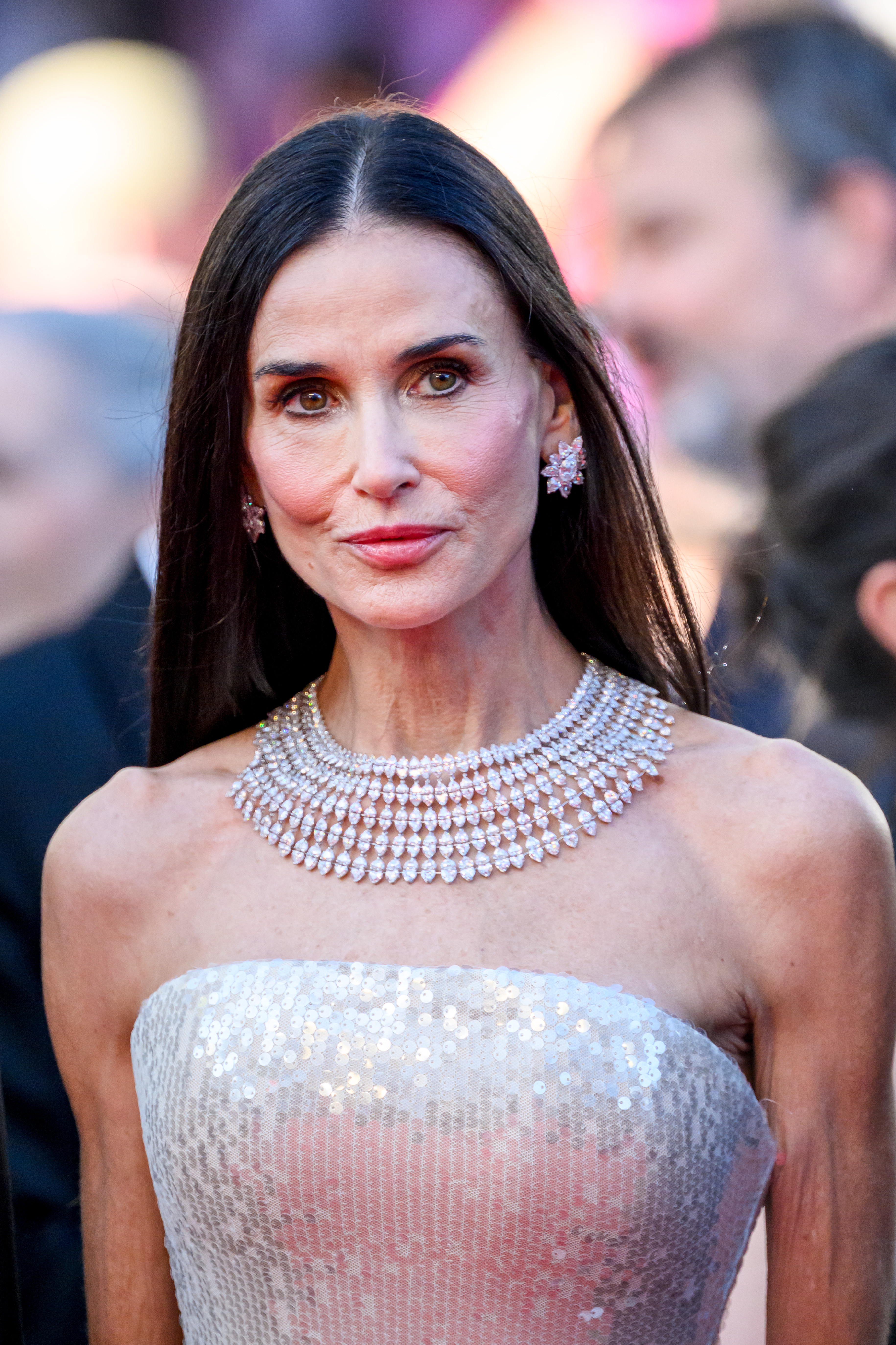 Demi Moore poses during a Cannes Film Festival red carpet appearance | Source: Getty Images