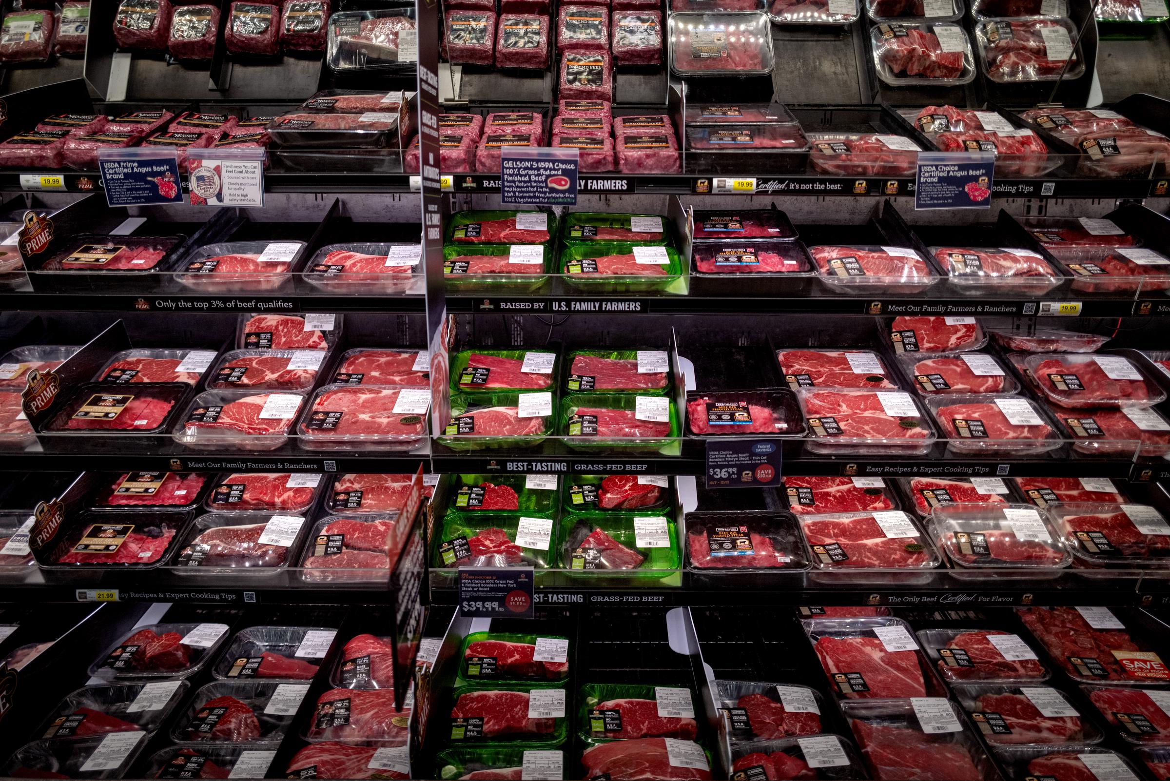 Rows of packaged beef products fill a large refrigerated meat case at a grocery store. | Source: Getty Images