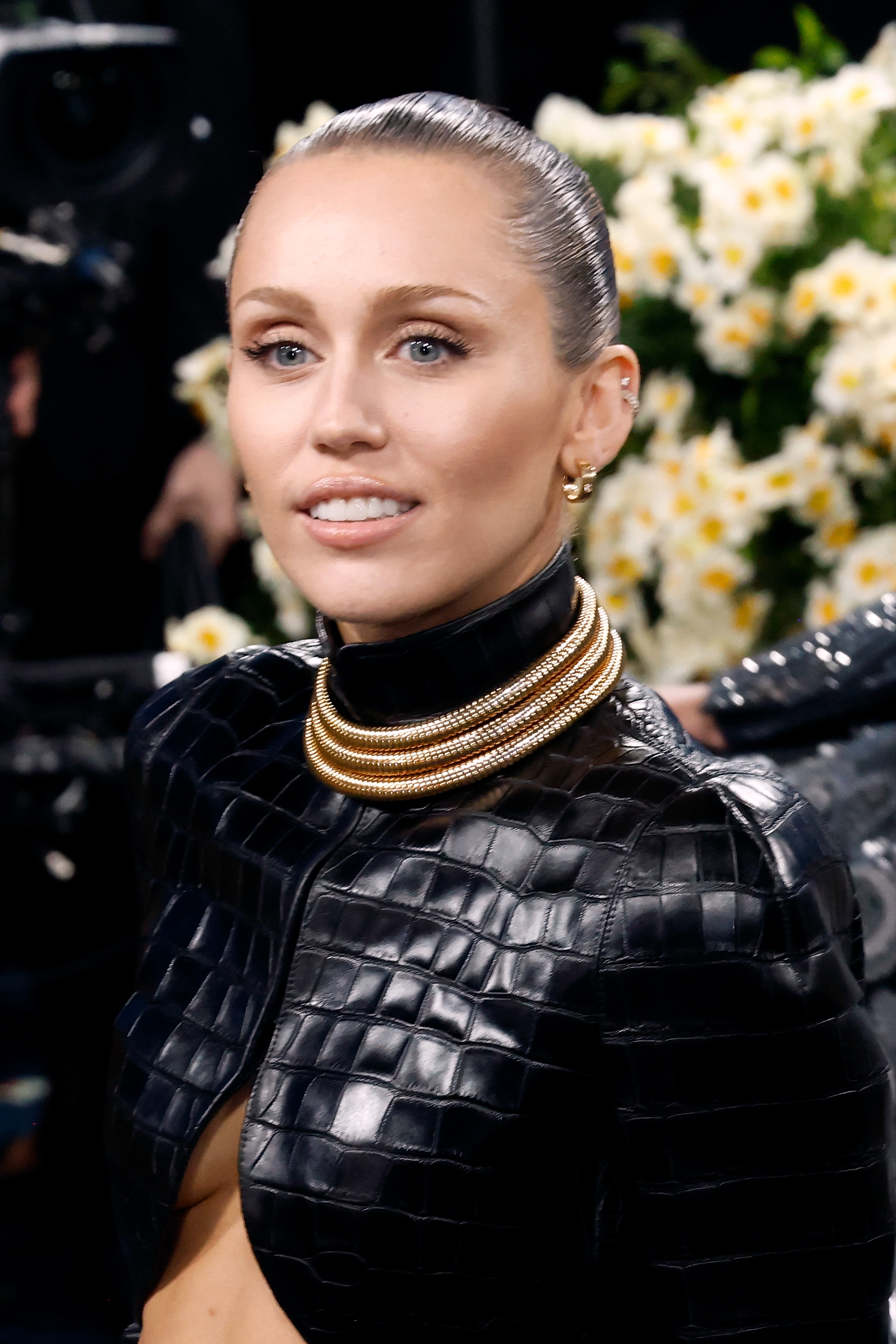 Miley Cyrus appeared in a close-up portrait that highlights her smile and facial features, the very details that have fueled online speculation about cosmetic procedures. While Reddit users have debated possible changes to her teeth and lips, Cyrus has described her appearance as a reflection of her emotional state, saying, “The way that I look or the way that I project is usually a sign of how I am mentally or emotionally.” | Source: Getty Images