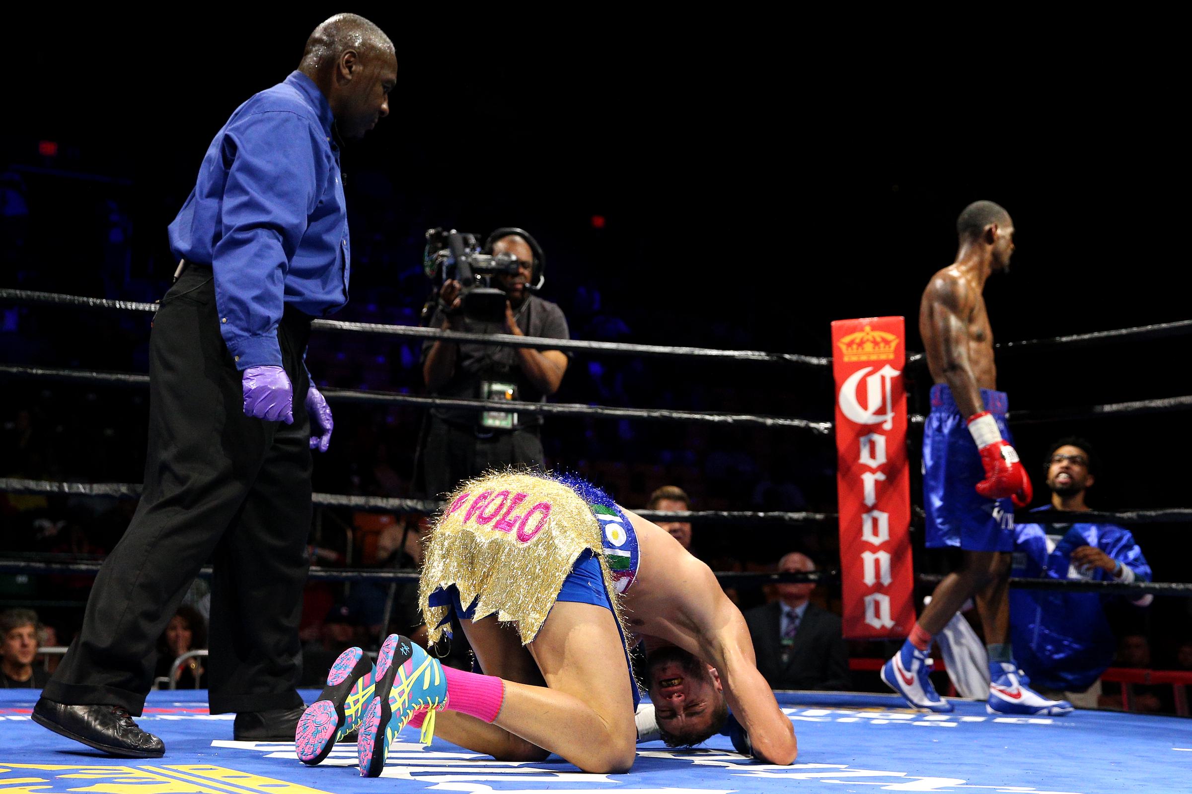 Prichard holds his head after falling to the canvas during his bout against Terrel Williams in Fairfax, Virginia. | Source: Getty Images
