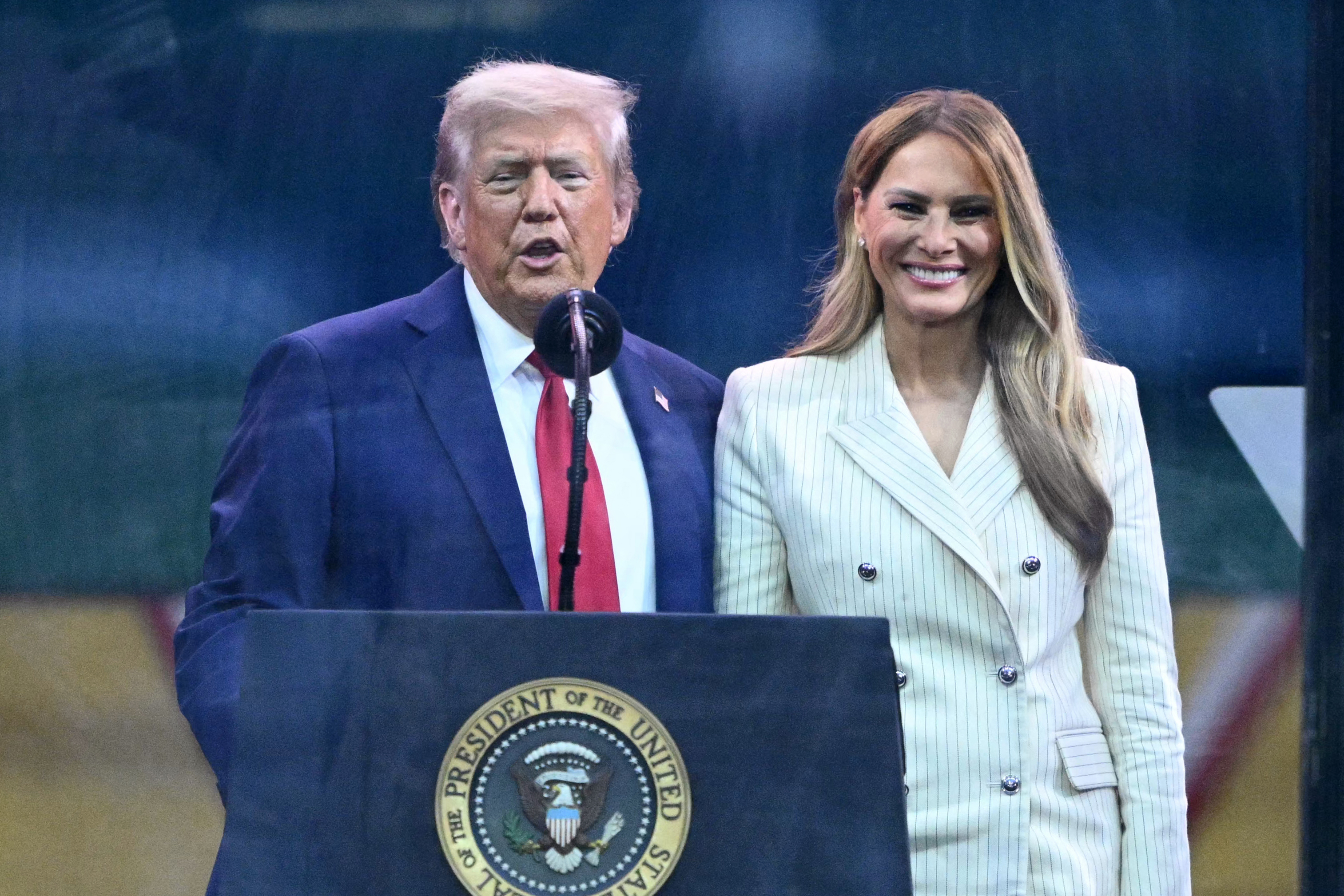 Donald Trump speaks next to Melania Trump after the Army 250th Anniversary Parade, on June 14, 2025 | Source: Getty Images
