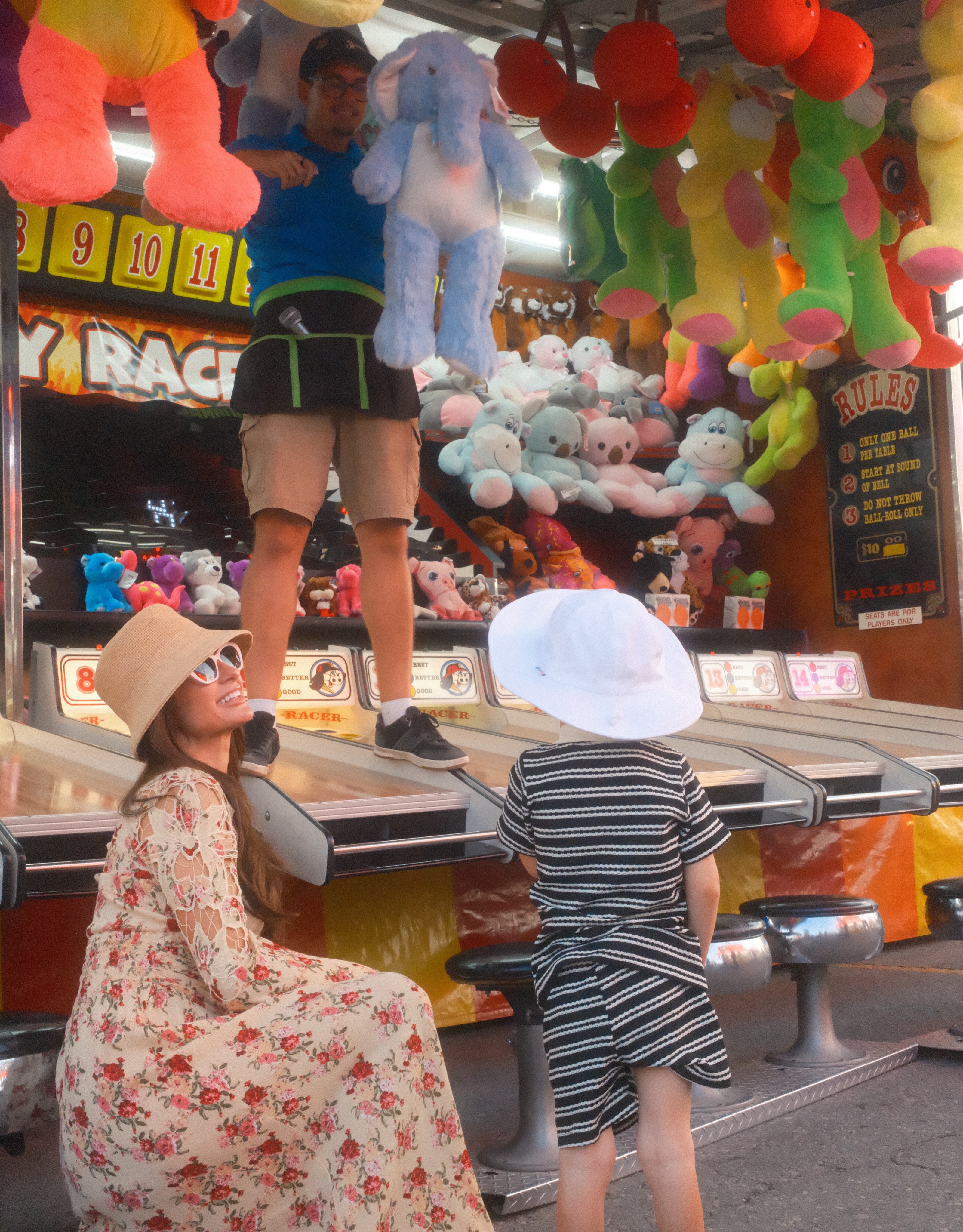 The family tried carnival games in addition to enjoying rides and time near the water. Paris's carousel captured a full day of ordinary festival fun despite her globally recognizable name. | Source: Instagram/parishilton