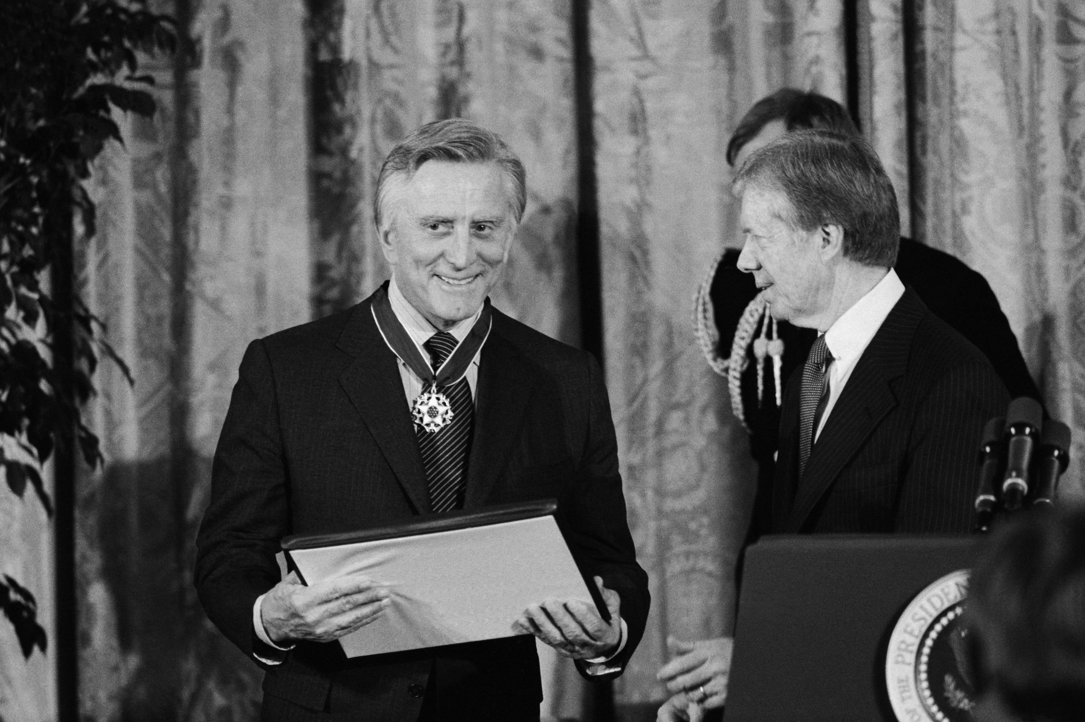 Kirk Douglas received the "Presidential Medal of Freedom," which was recently announced to be passed down to his grandson Cameron Douglas, from President Jimmy Carter on January 16, 1981, in Washington, DC. | Source: Getty Images