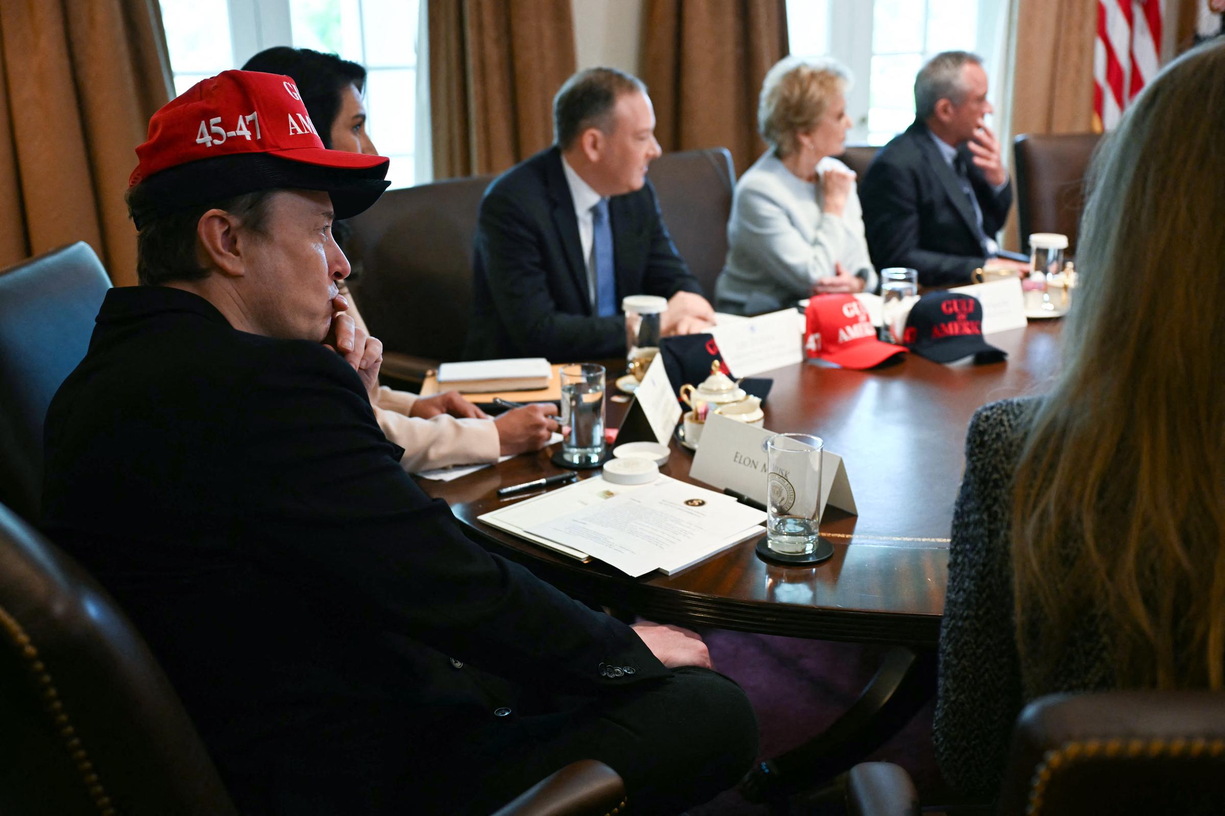 Elon Musk's wearing a Gulf of America cap while sitting with other officials at a cabinet meeting | Source: Getty Images