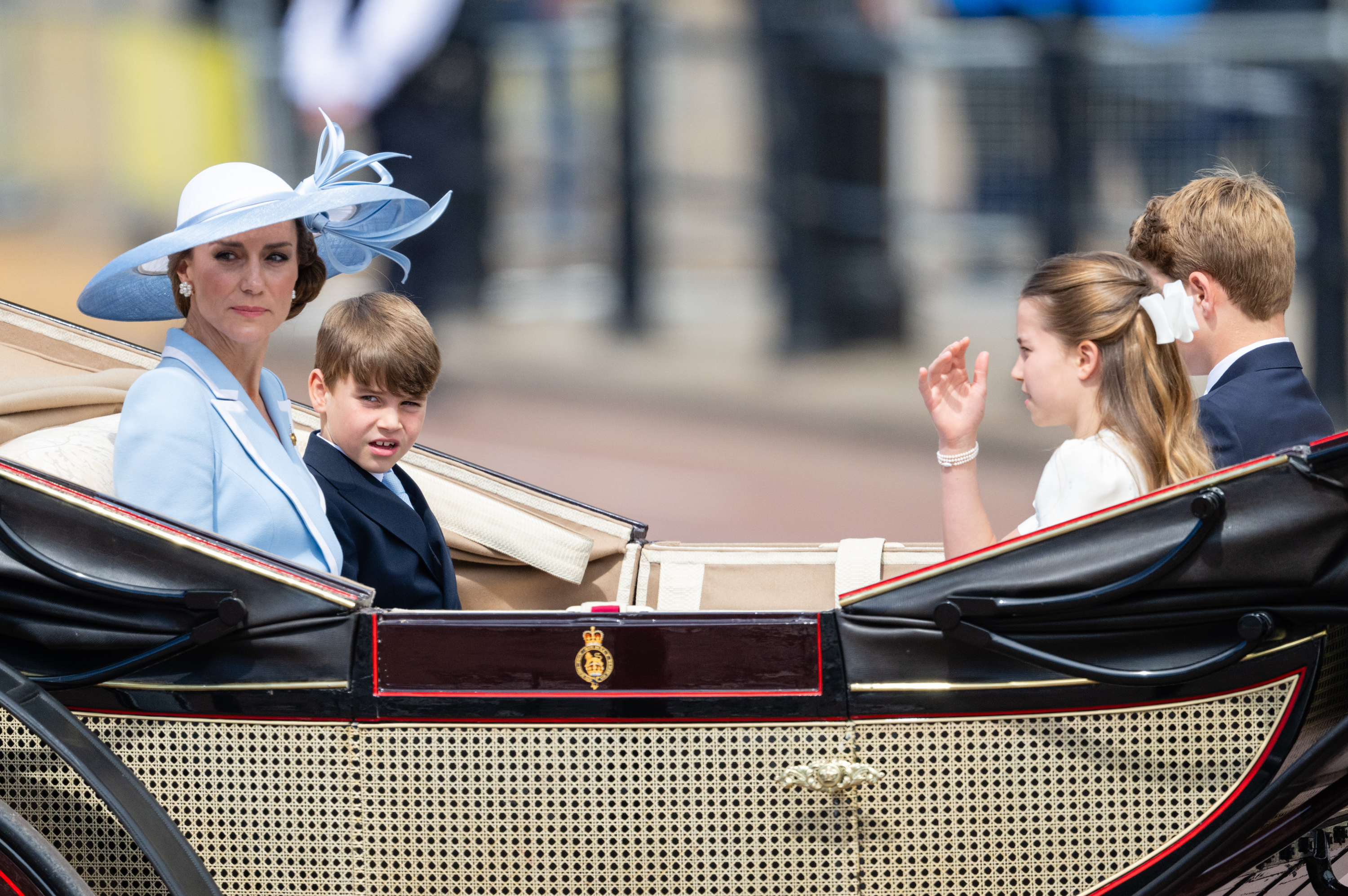 The royal family maintained serious expressions while traveling in the carriage, though the bright sunshine may have contributed to their solemn look. In this photo, Catherine, Princess of Wales, Prince Louis of Wales, Princess Charlotte of Wales, and Prince George of Wales were seen arriving for Trooping the Colour at Buckingham Palace on June 13, 2026, in London, England. | Source: Getty Images