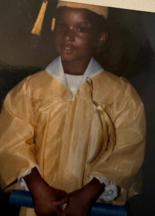 The actress poses in a graduation cap and gown as a child | Source: Instagram/iamjhud
