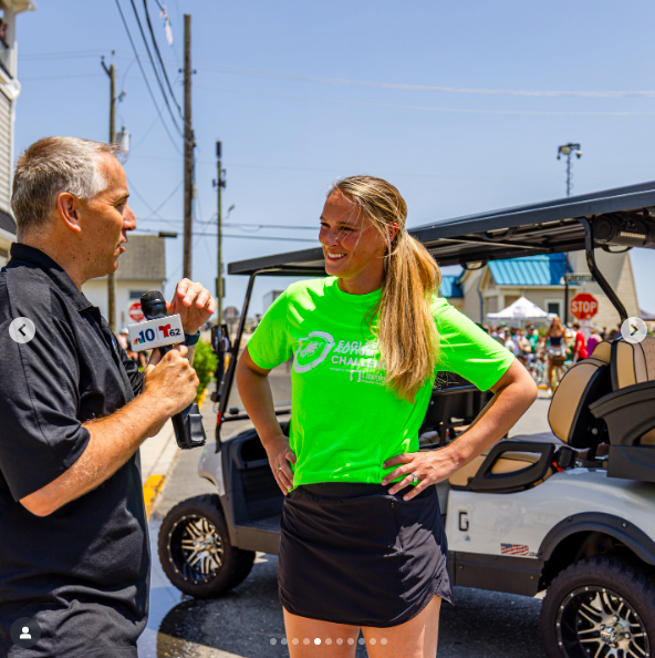 Kylie Kelce chatting to a reporter during the Eagles Autism Foundation event, posted on June 30, 2025. | Source: Instagram/eaglesautism