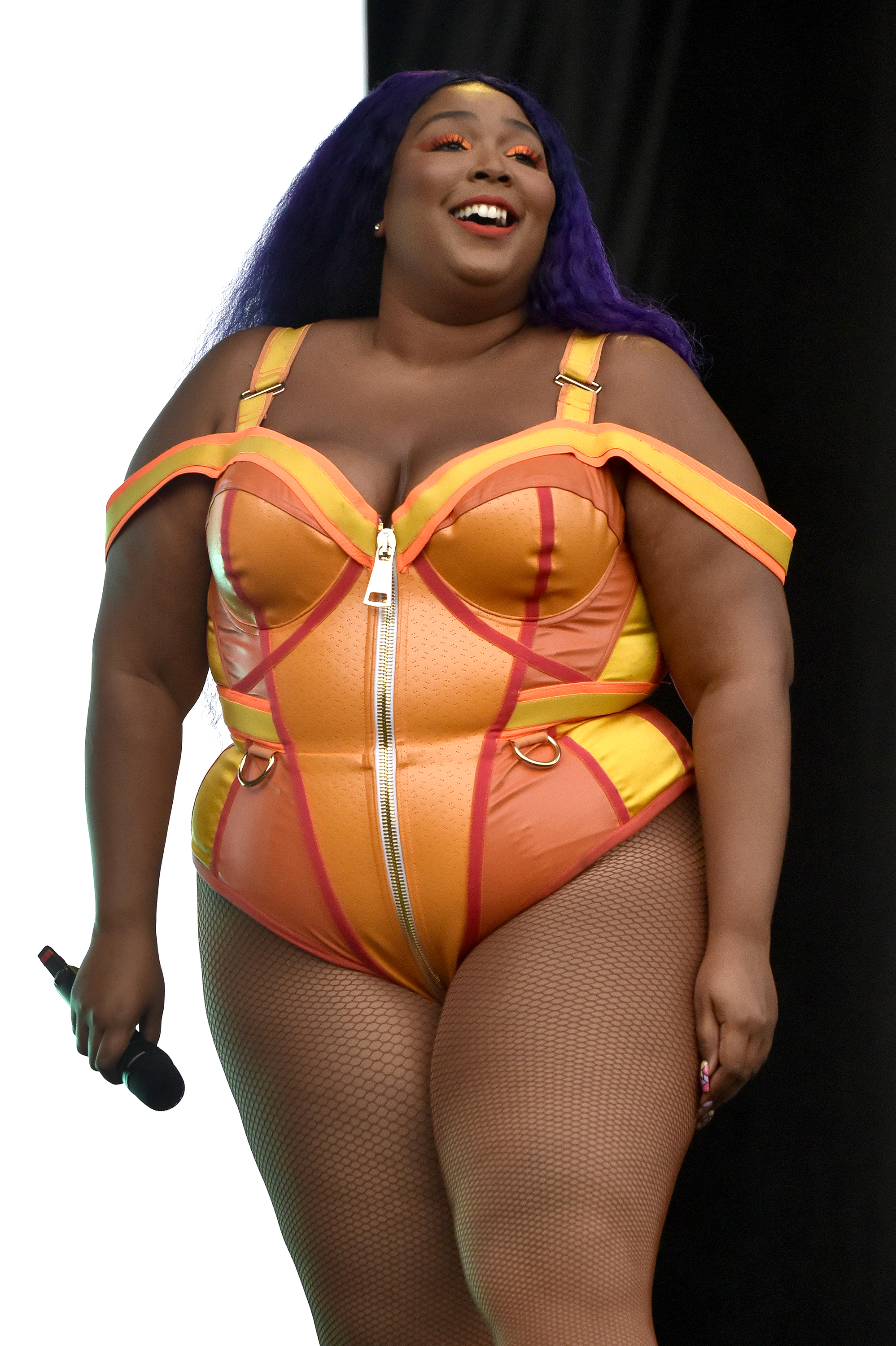 Beaming onstage at ACL Festival, Lizzo exudes joy and confidence, fully embracing the spotlight as the crowd looks on. In a vibrant, body-celebrating look, the moment reflects her peak rise — where self-expression and star power go hand in hand.