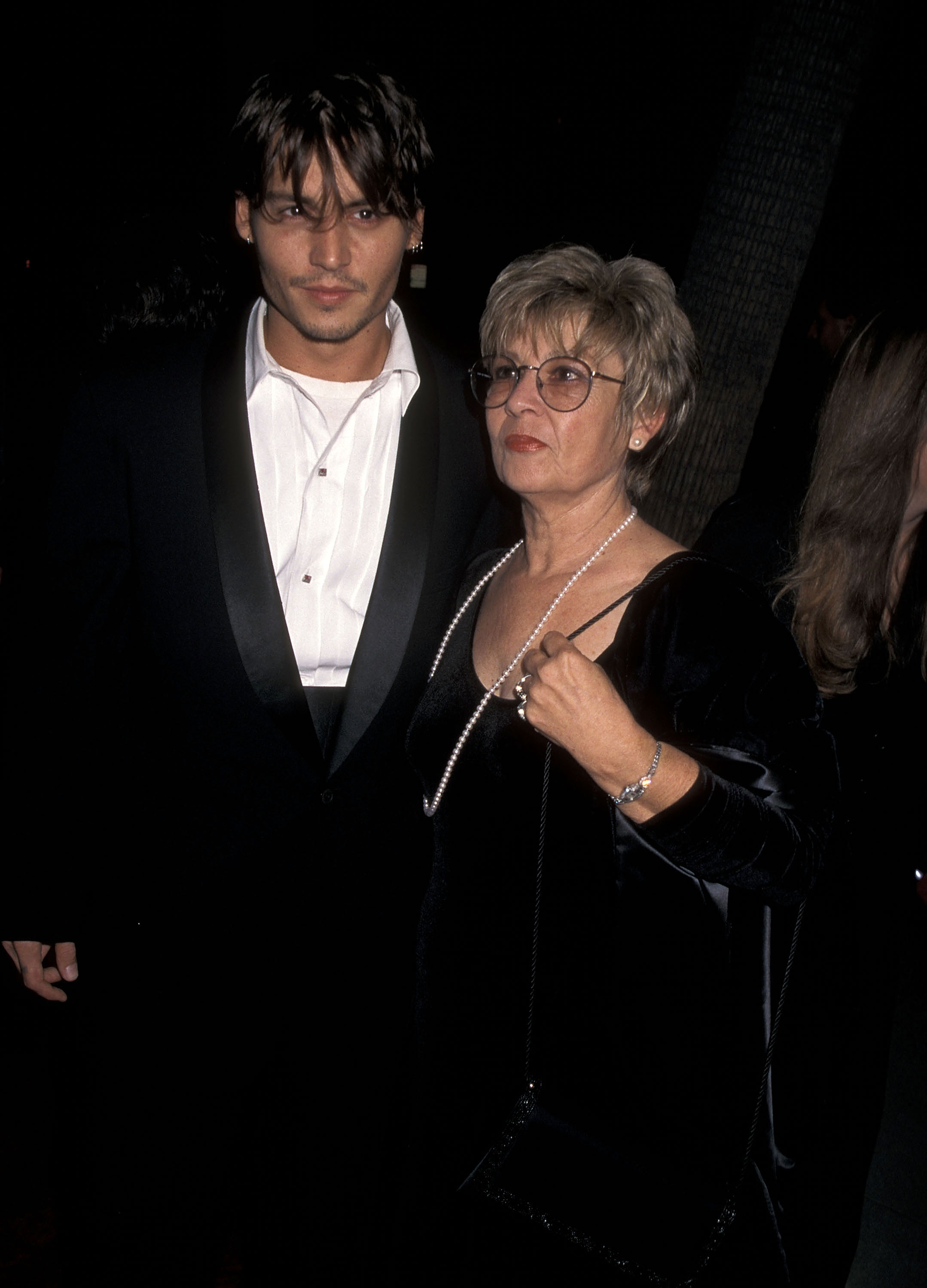 Johnny Depp and his mother Betty Sue Palmer attend the "Nick of Time" premiere at the Samuel Goldwyn Theater in Beverly Hills, California, on November 20, 1995 | Source: Getty Images
